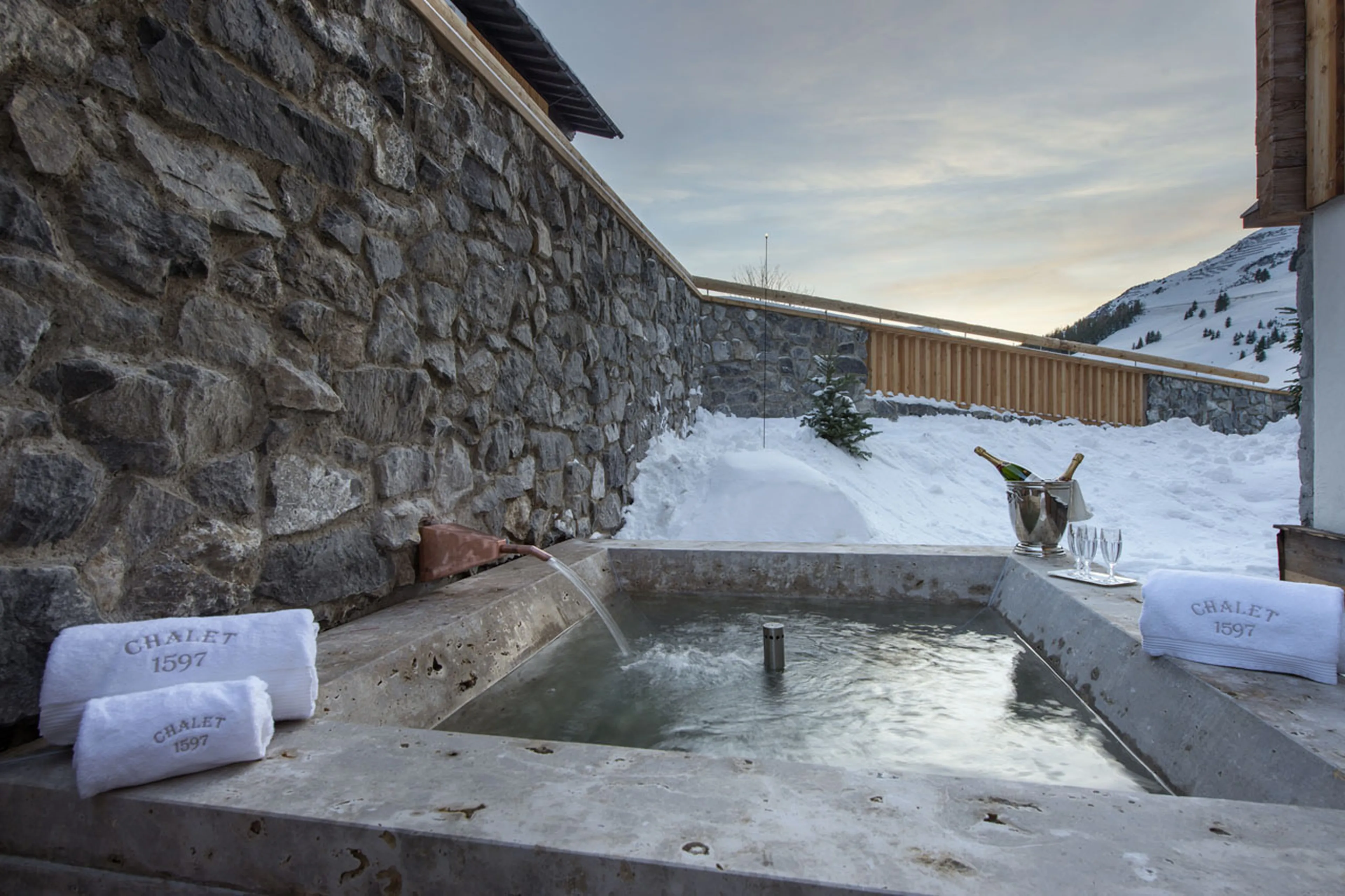 The traditional hot tub outside Chalet 1597 is unique in Lech