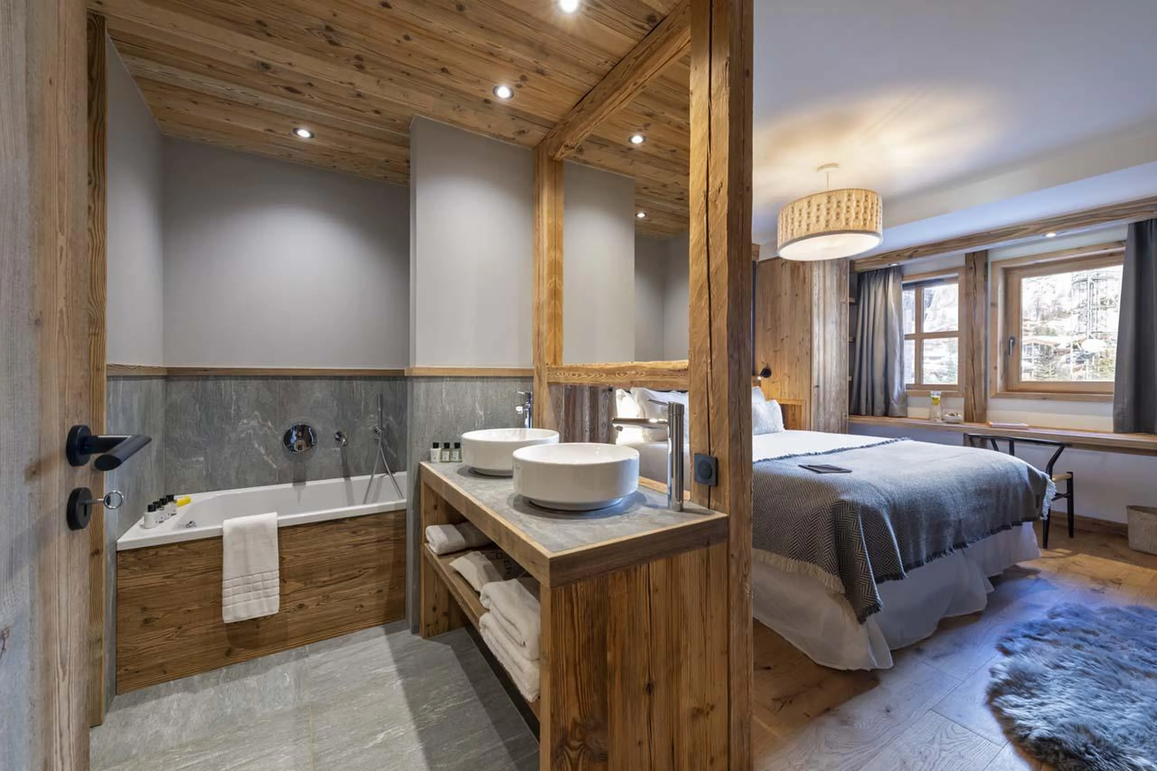 En-suite bathroom with bath, shower and double basin at Chalet 1850 in Val d'Isere