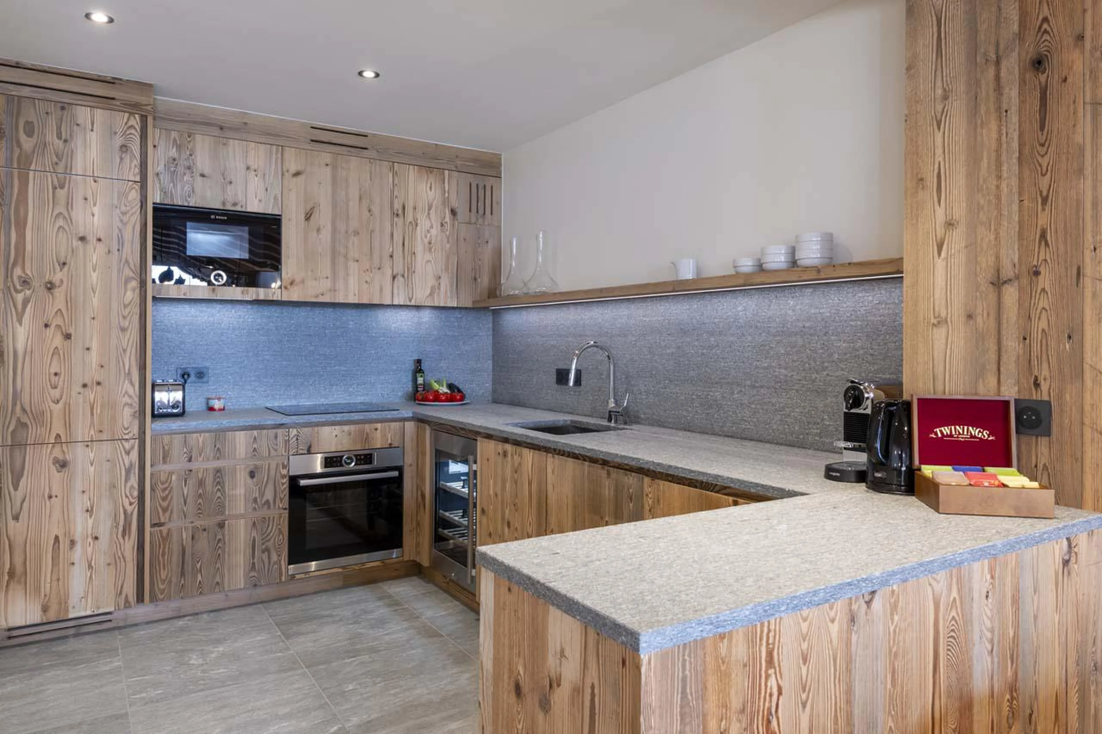 Kitchen equipped with modern appliances at Chalet 1850 in Val d'Isere