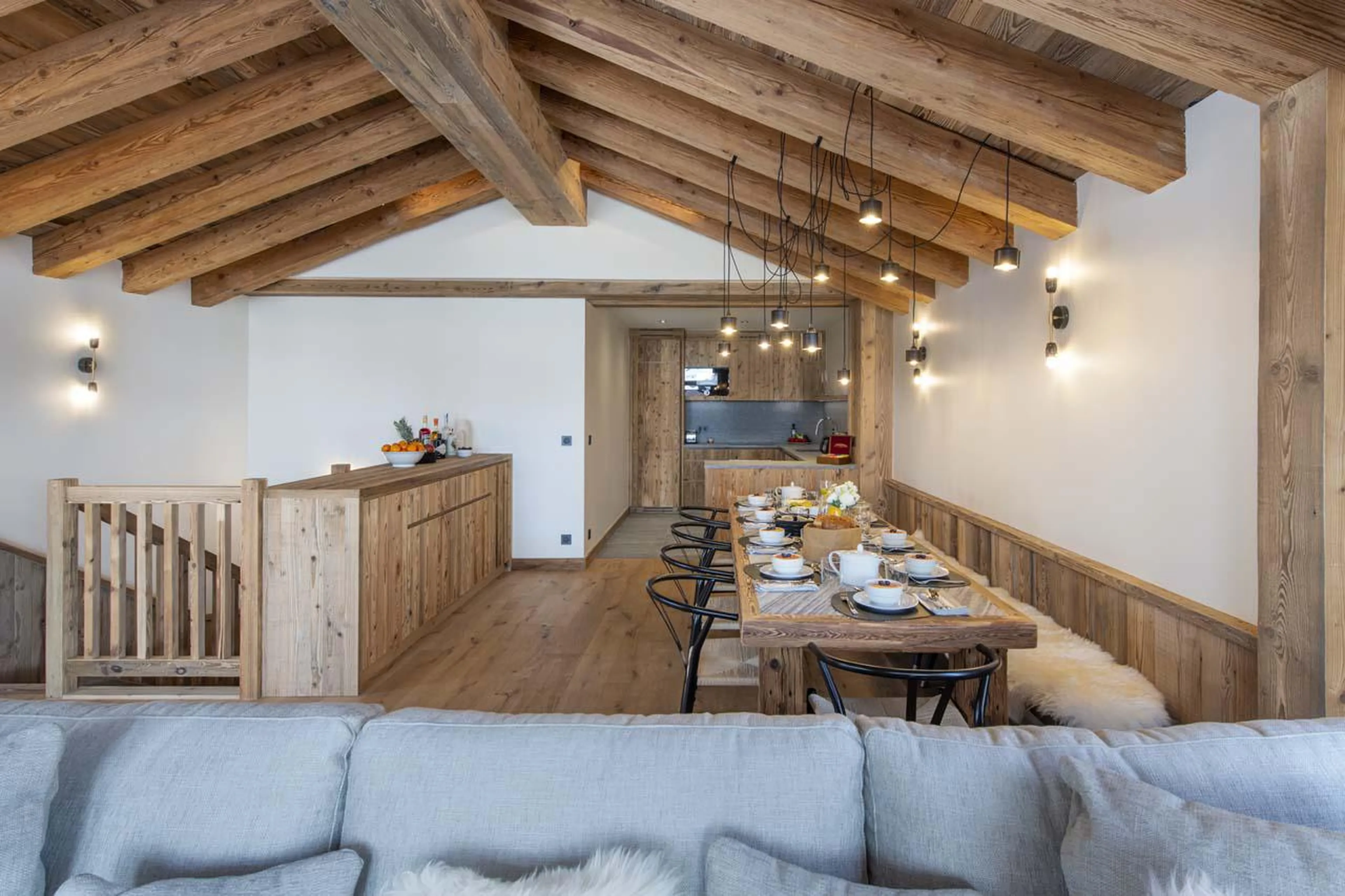 Open-plan area with living, dining and kitchen space at Chalet 1850 in Val d'Isere