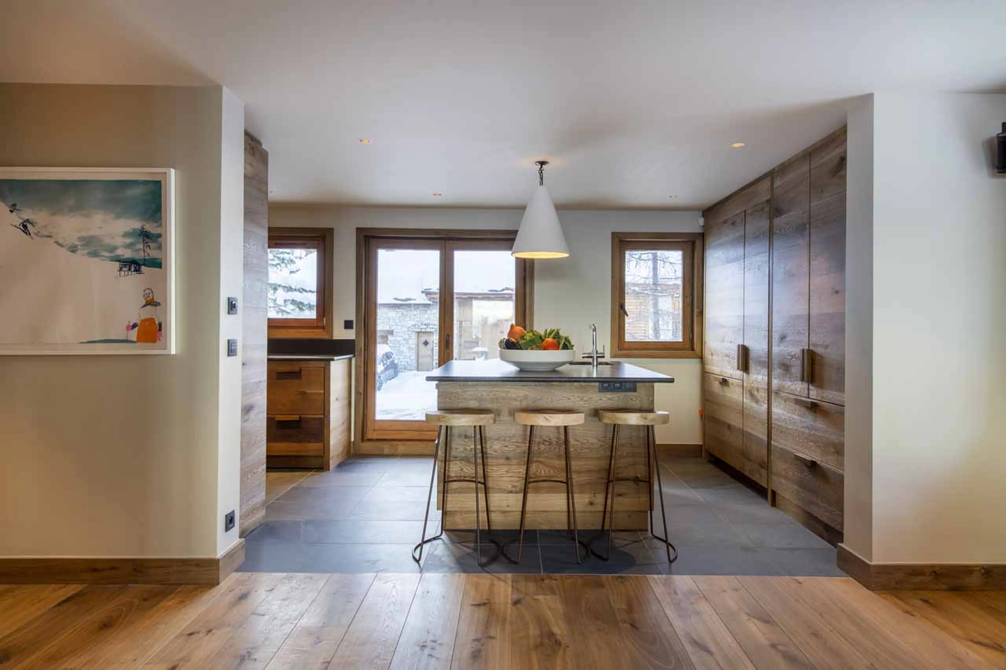 Kitchen with bar seating at Chalet Abade in Val d'Isere