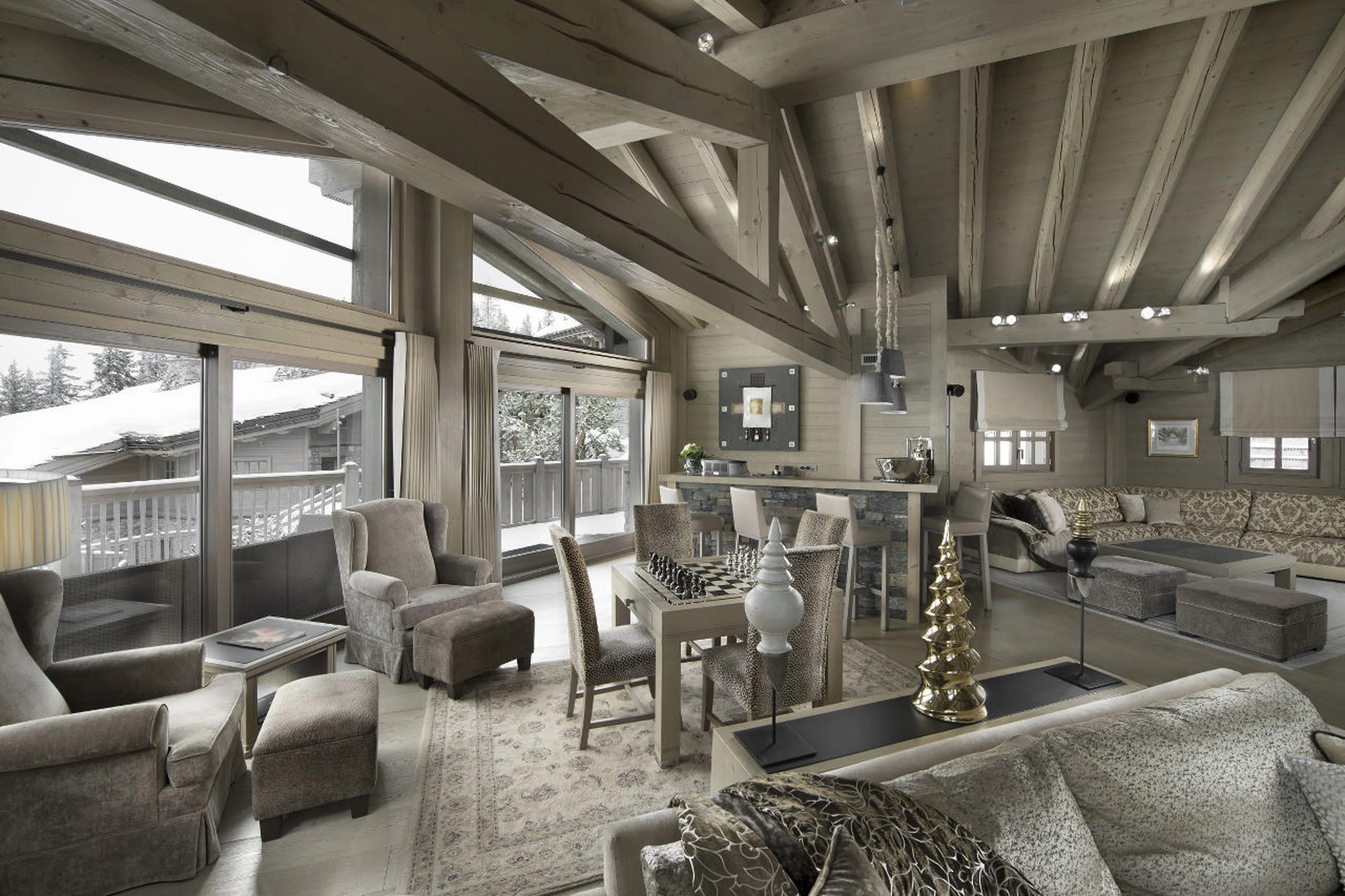 Open plan living with vaulted ceiling and terrace access in Chalet Abruzzes in Courchevel 1850