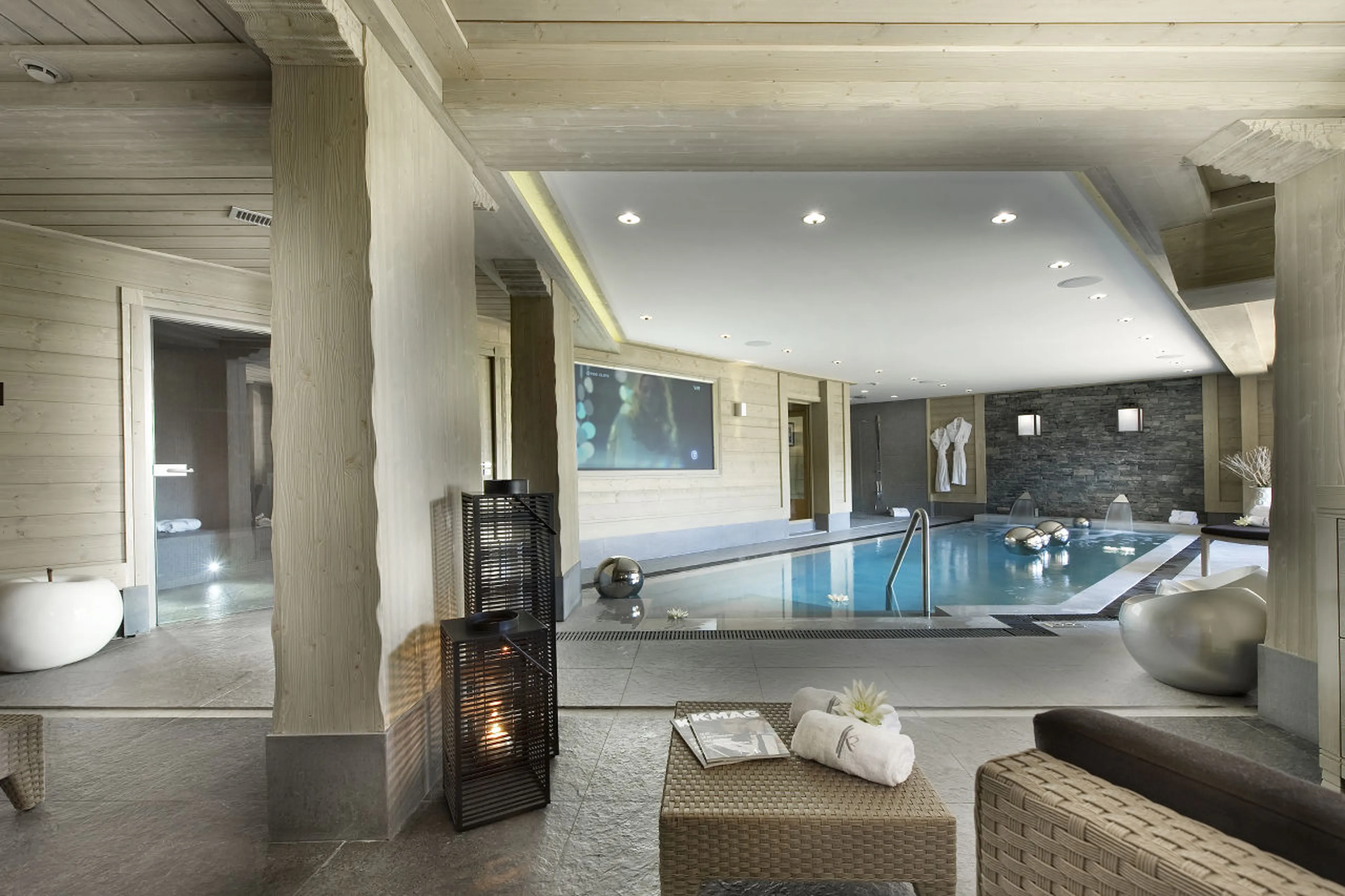 Pool with waterfall features and terrace access in Chalet Abruzzes in Courchevel 1850