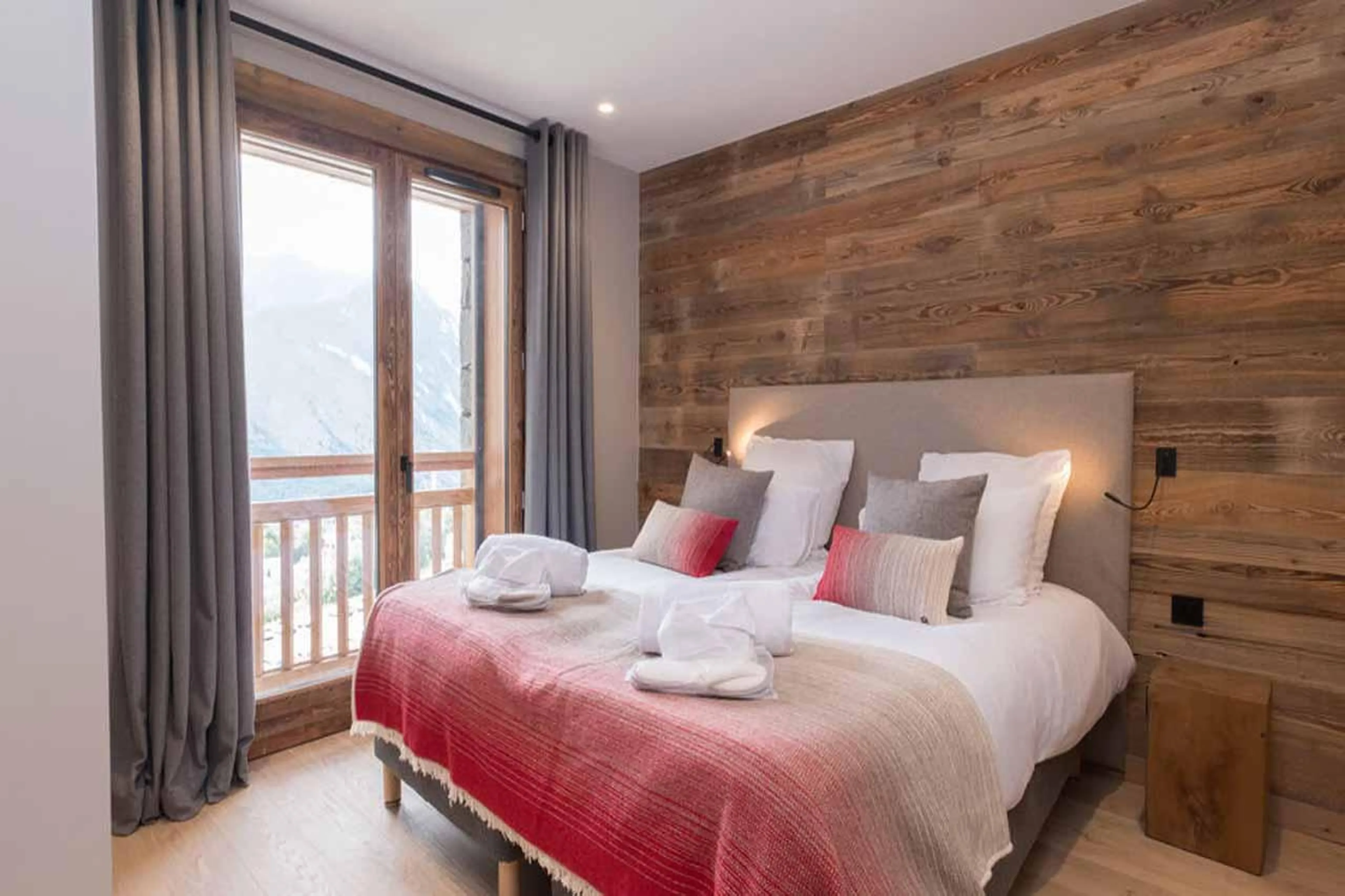 Double bedroom with French doors in Chalet Acolou, Saint Martin de Belleville