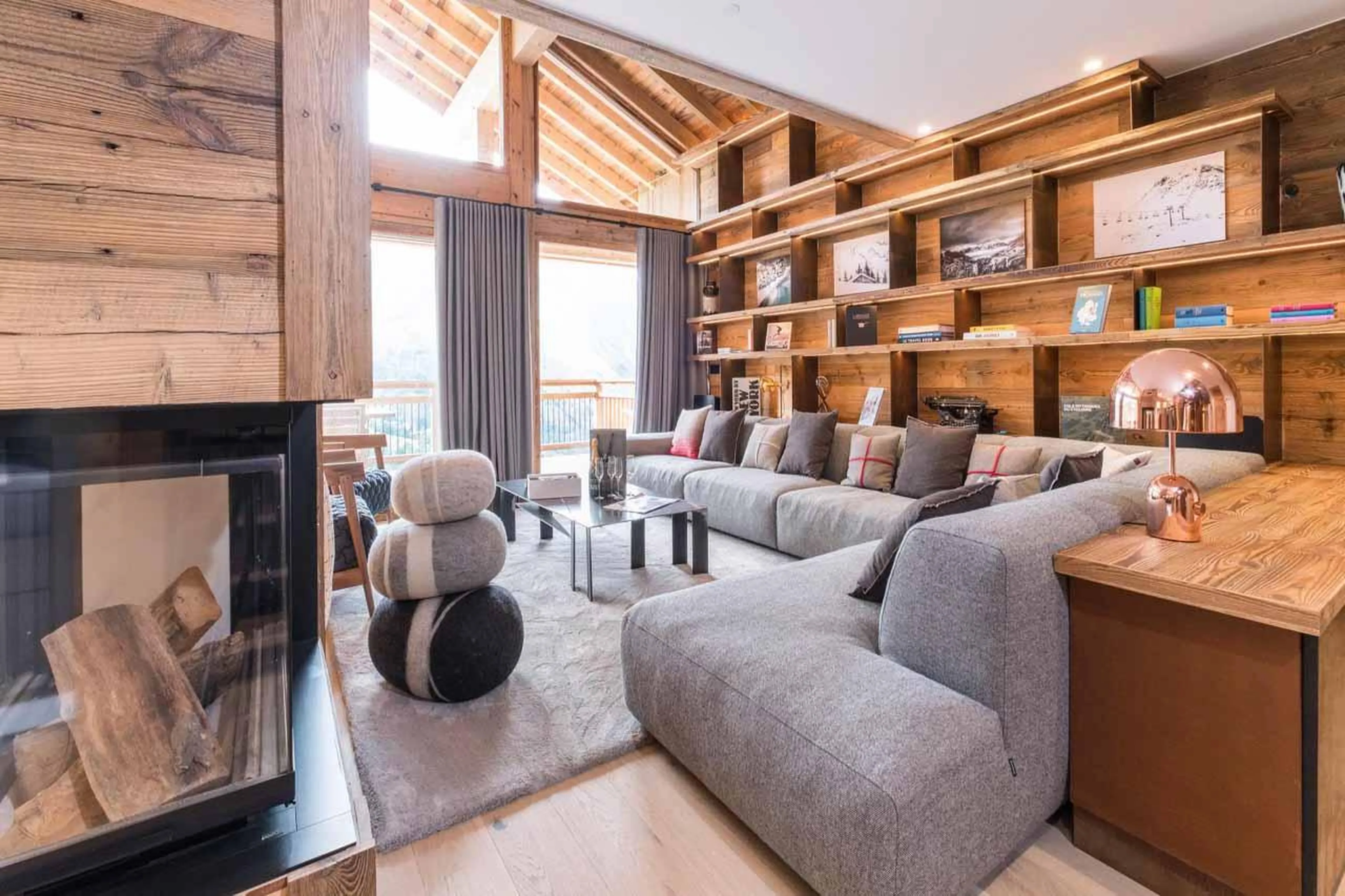 Comfortable wrap-around sofa in living area in Chalet Acolou, Saint Martin de Belleville