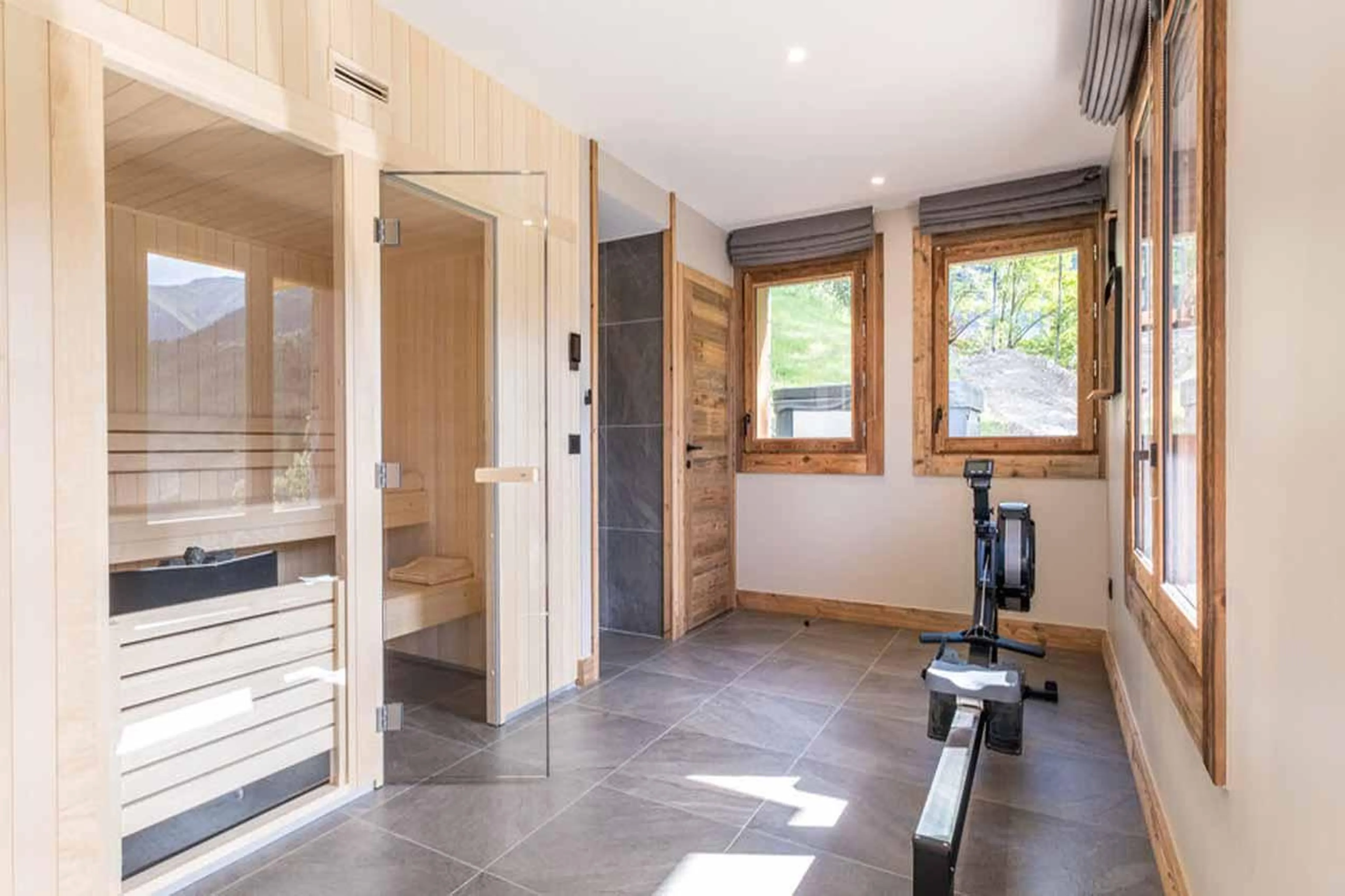 Spa area with sauna and rowing machine in Chalet Acolou, Saint Martin de Belleville