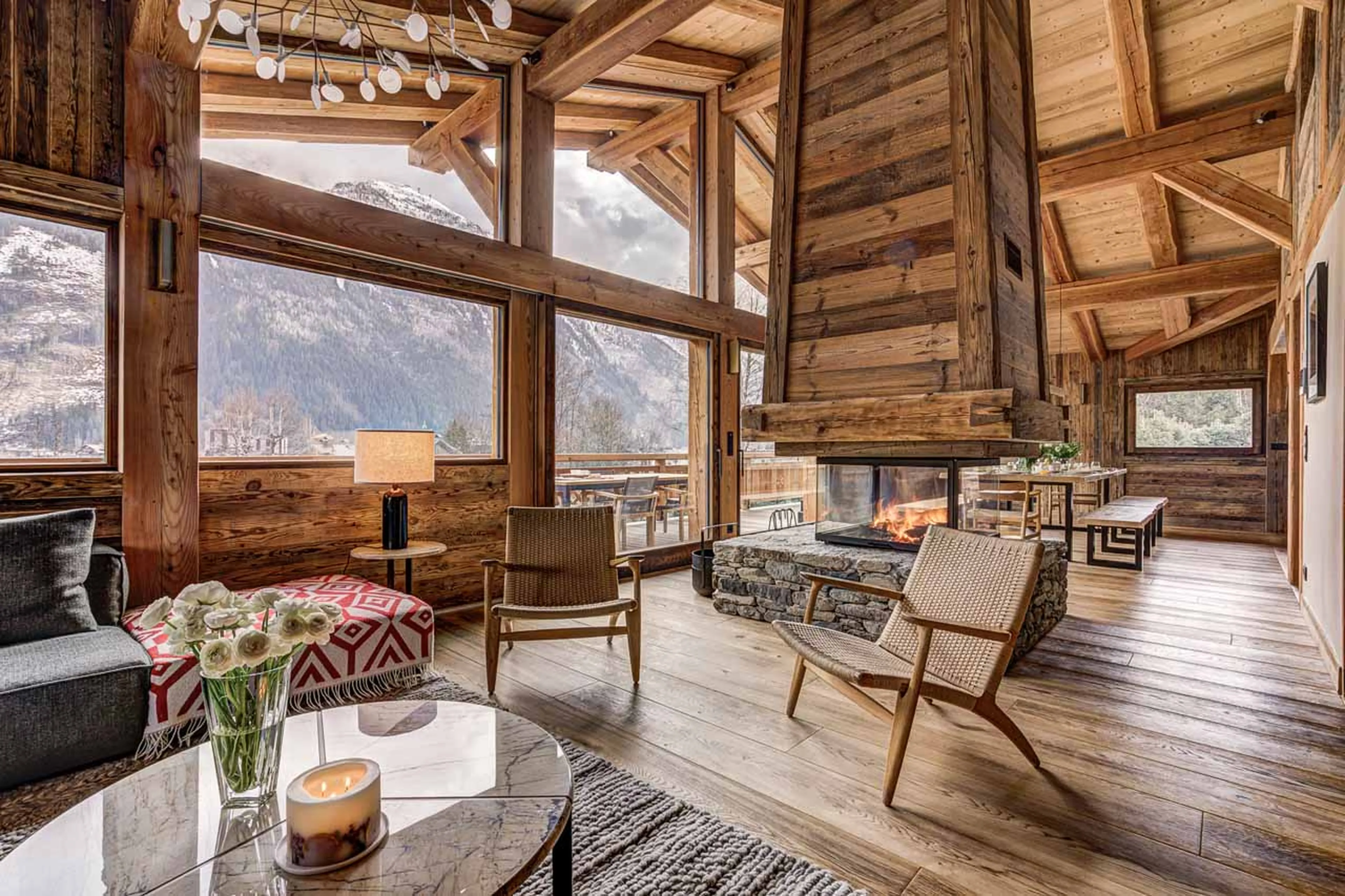 Sofa area and fireplace at Chalet Alaska in Chamonix