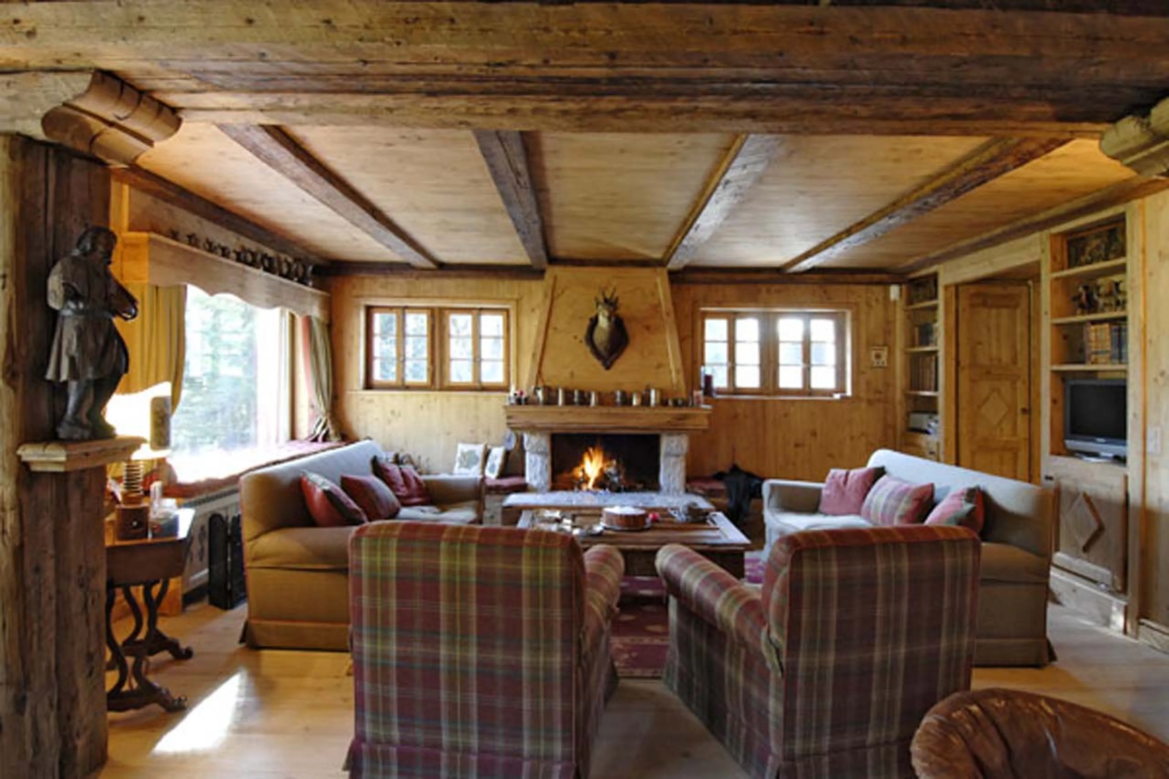 Fireplace in living area of Chalet Alouette in Crans Montana