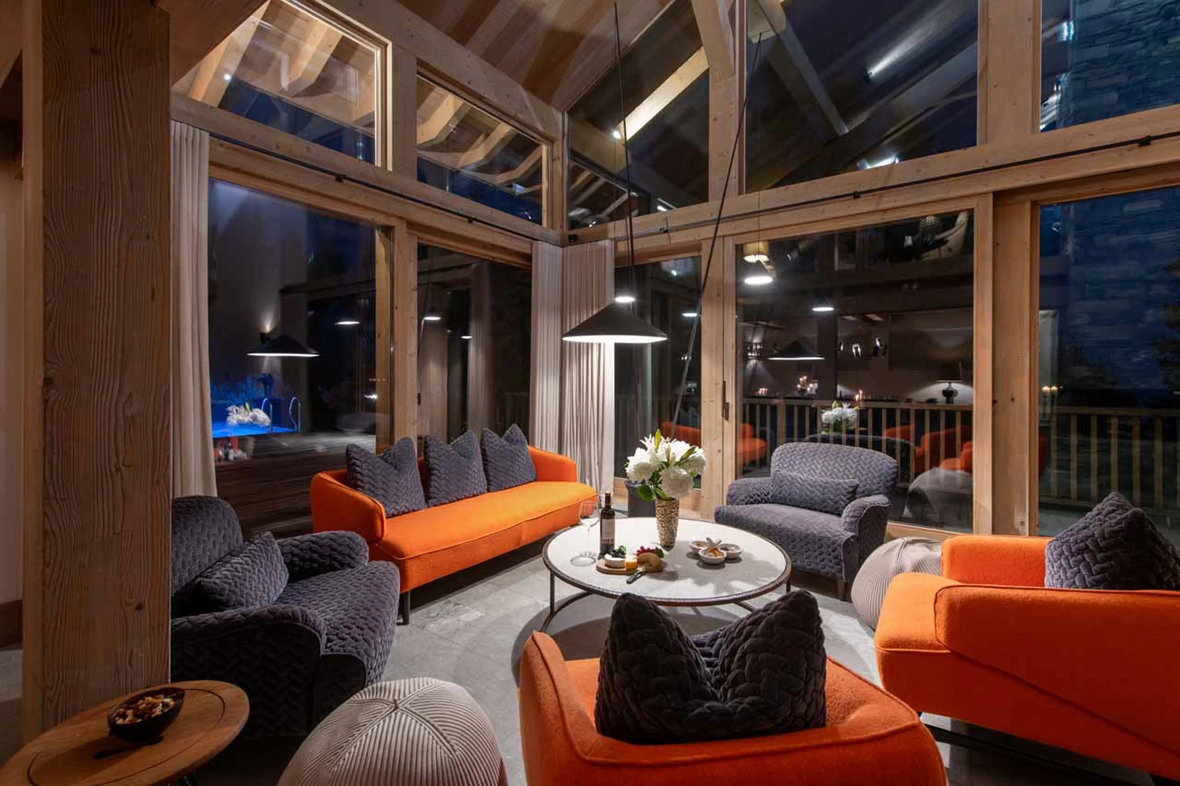 Seating and windows in living area t Chalet Alpaca in Meribel