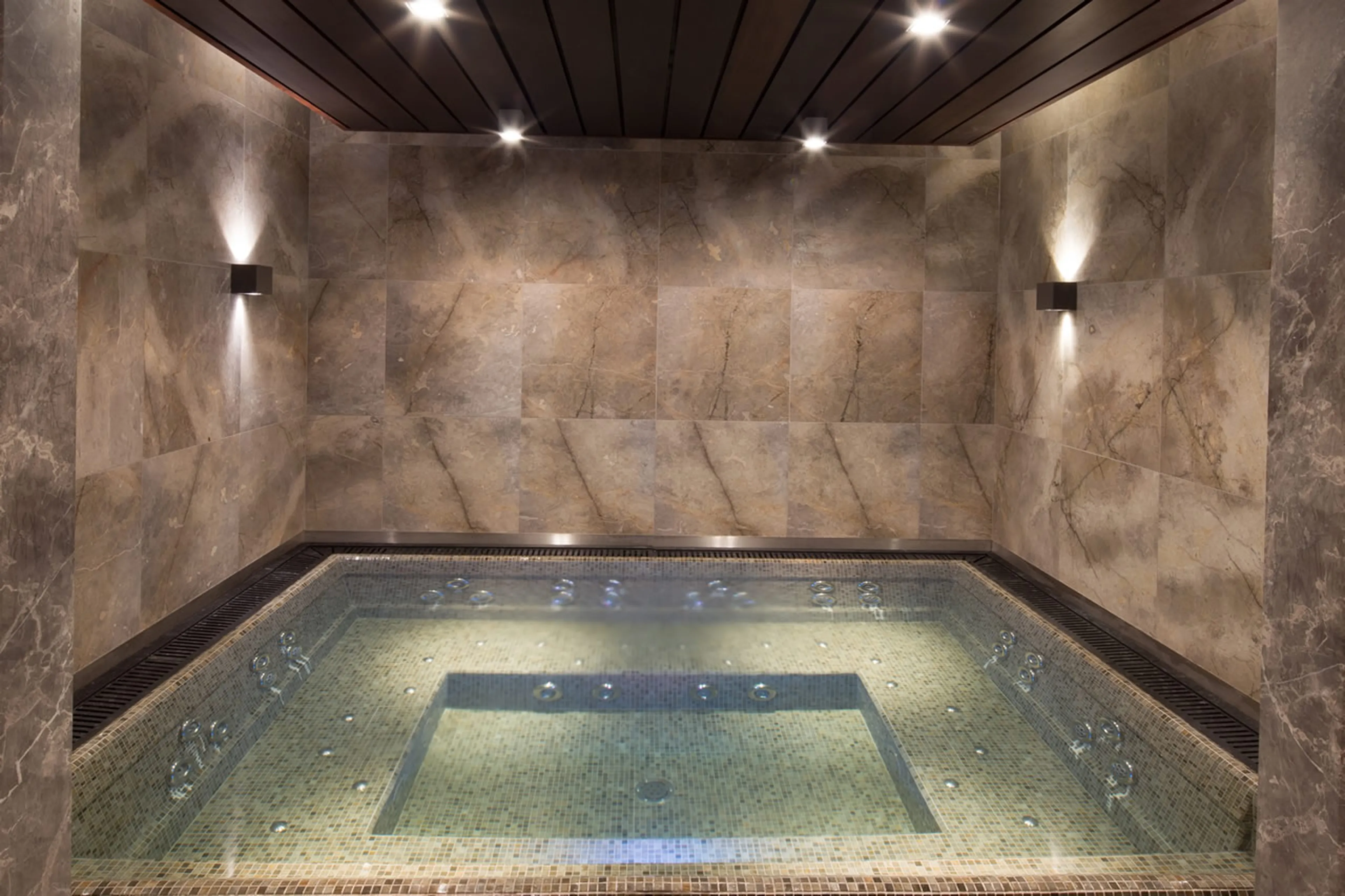 Private spa with Jacuzzi on lower ground floor of Chalet Alpensia in Courchevel 1850