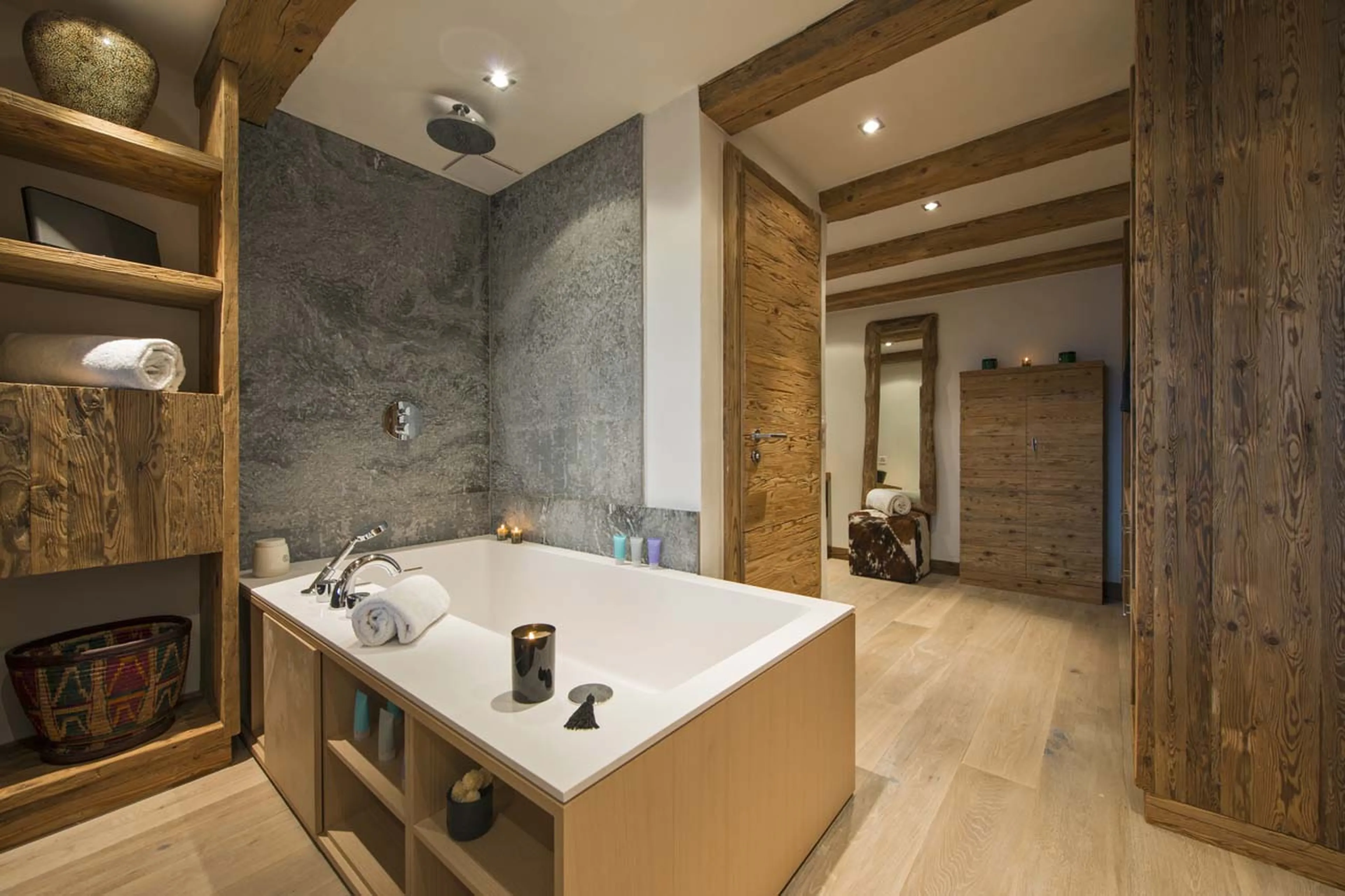 Bath tub and dressing area of master bedroom at Chalet Alpine Roc in Verbier