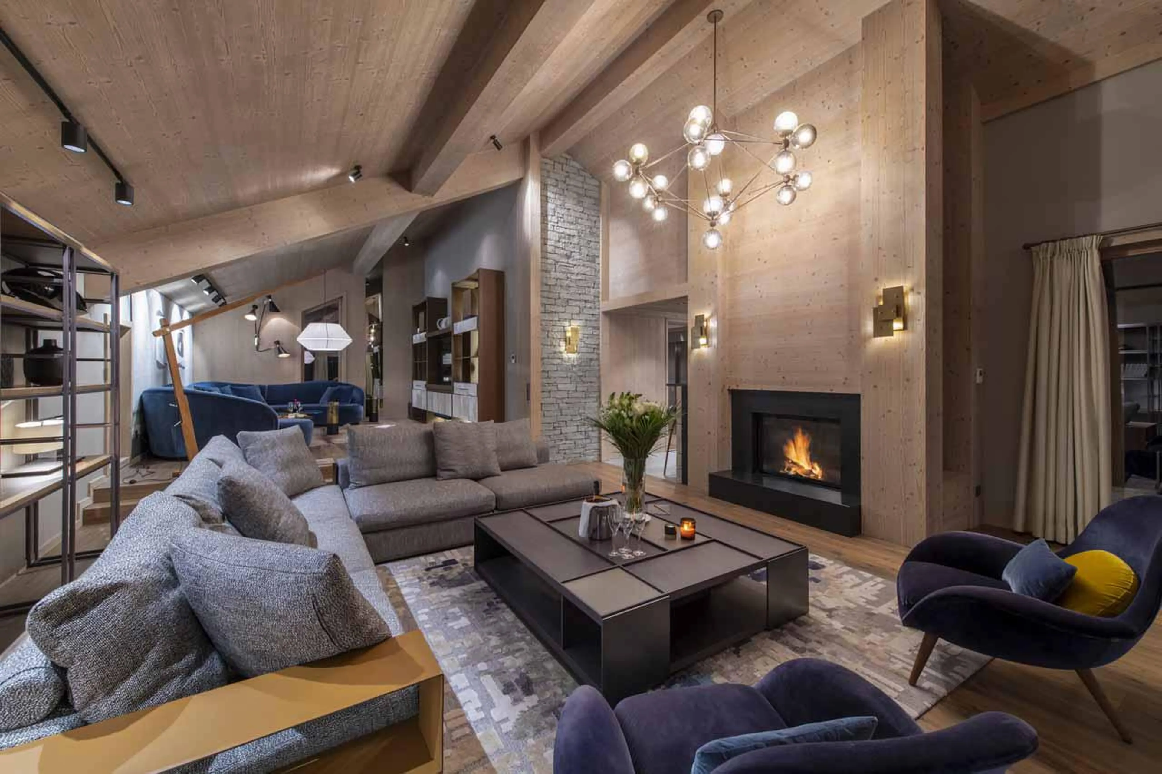 Living room with fireplace at Chalet Altius in Meribel
