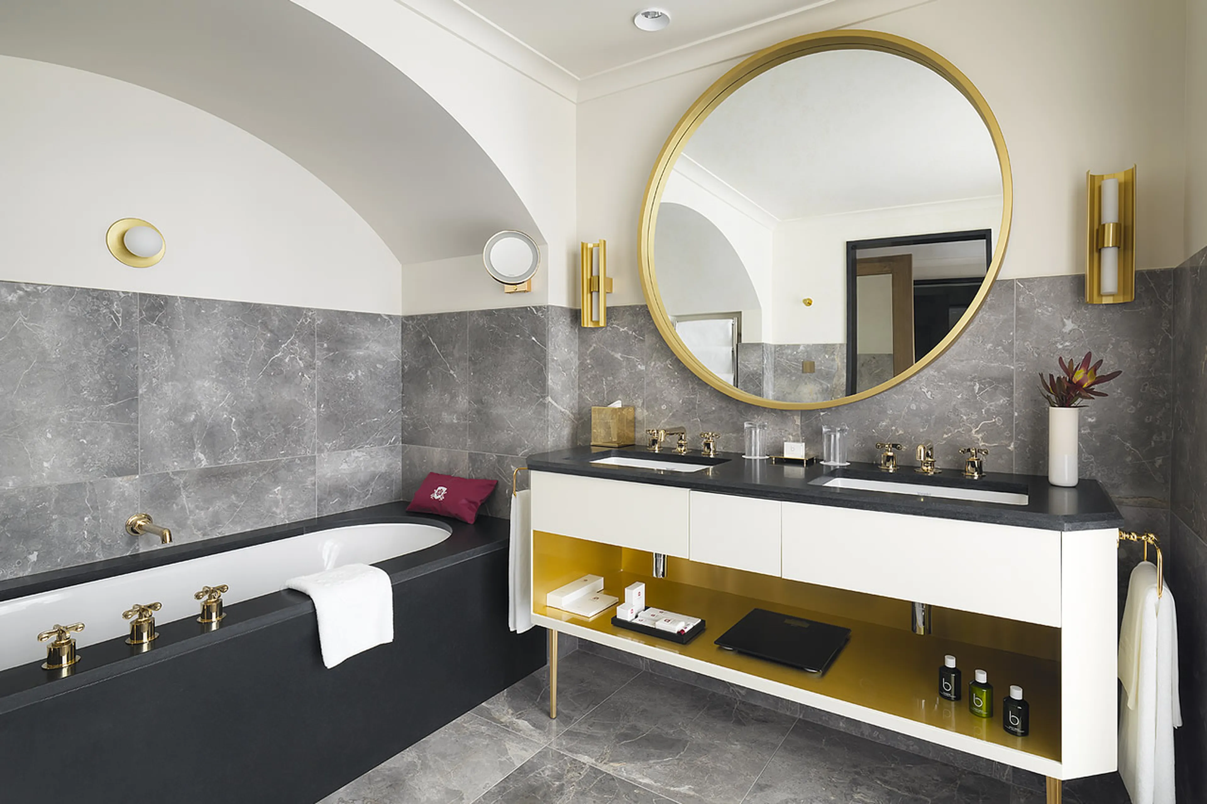 En suite bathroom with bath, double basin and shower in Chalet Amarante in Courchevel 1850