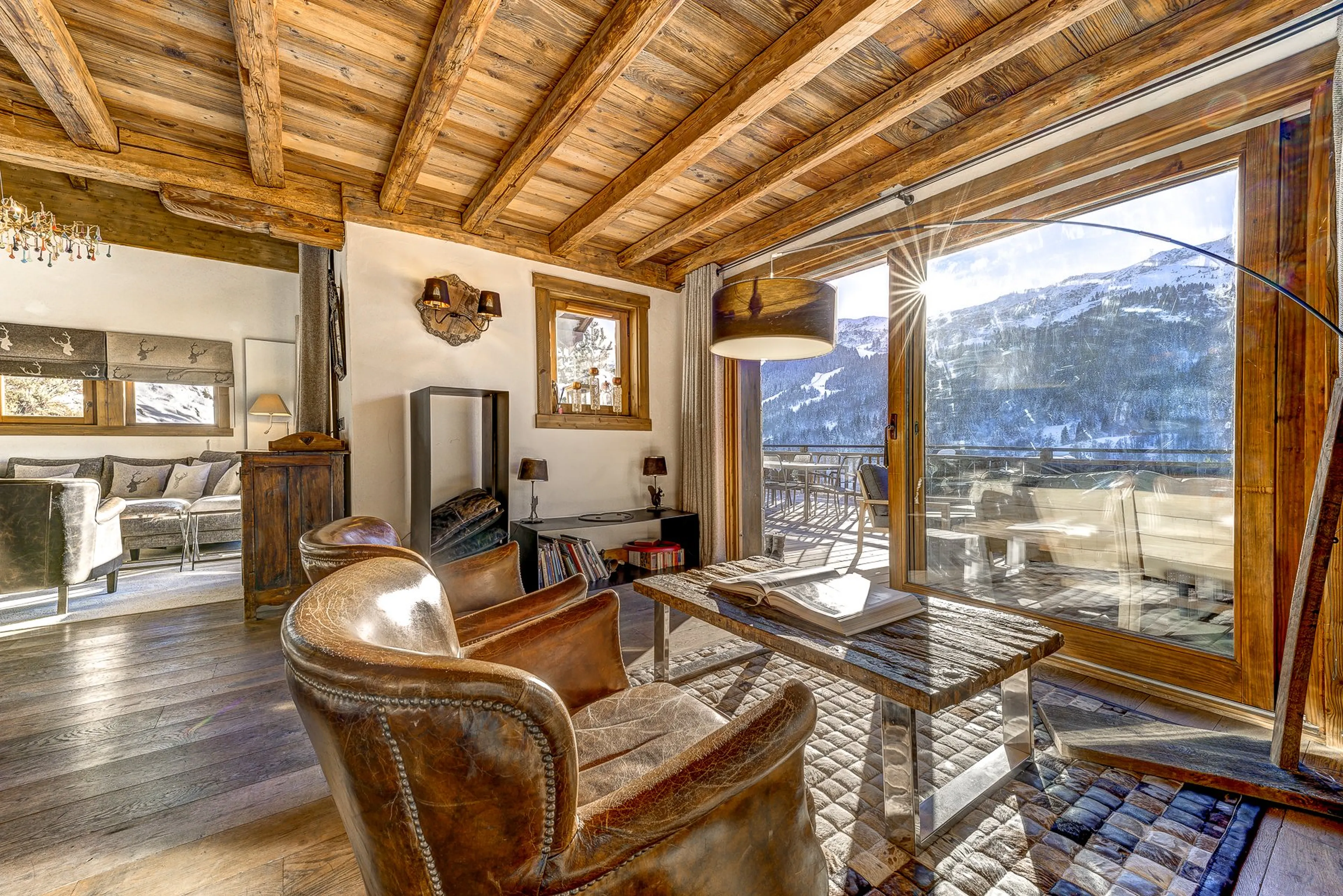 Living area opening onto terrace at Chalet Amarena in Meribel