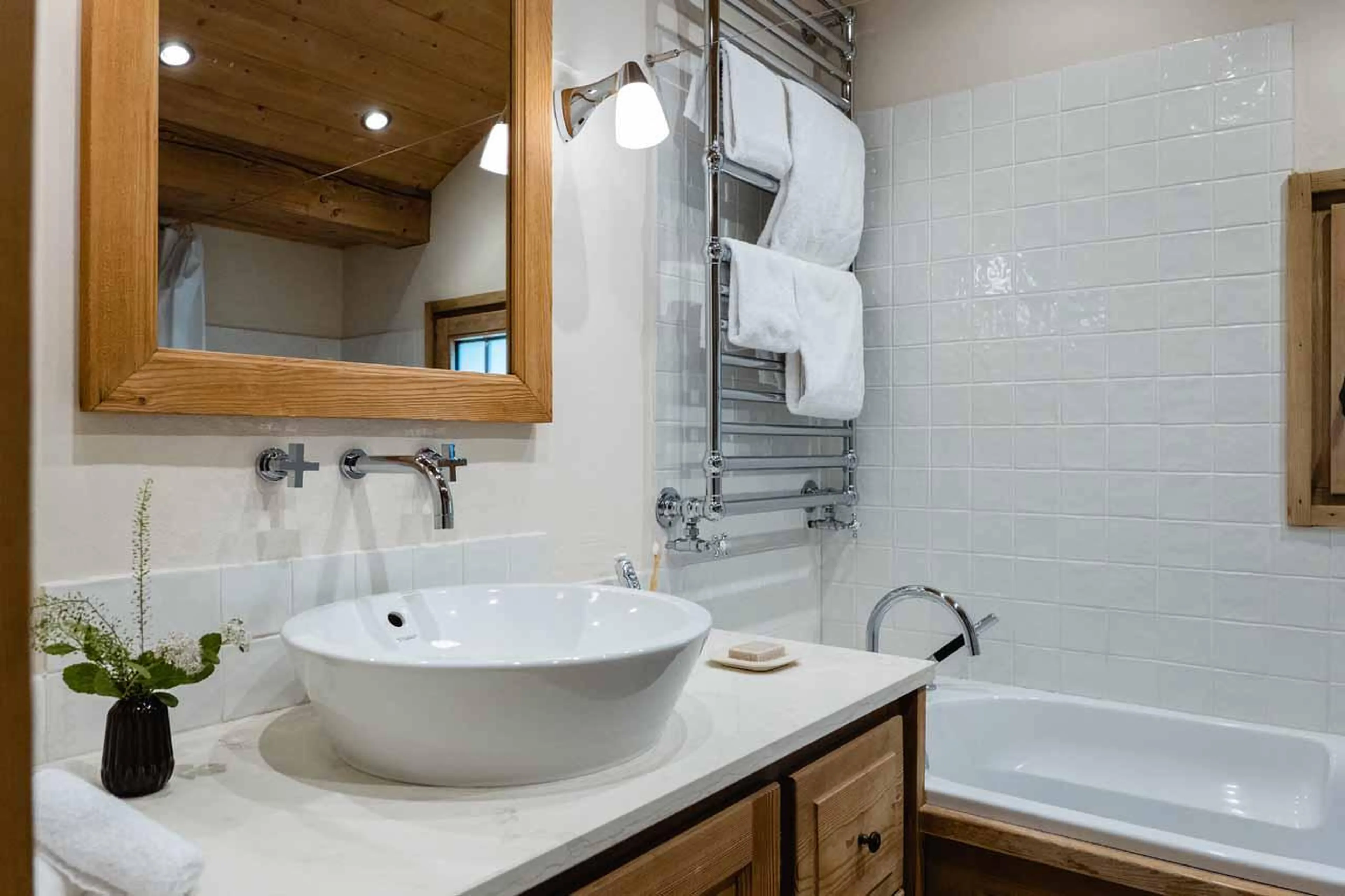 Bathroom with bathtub and basin in Chalet Ambroise, Megeve