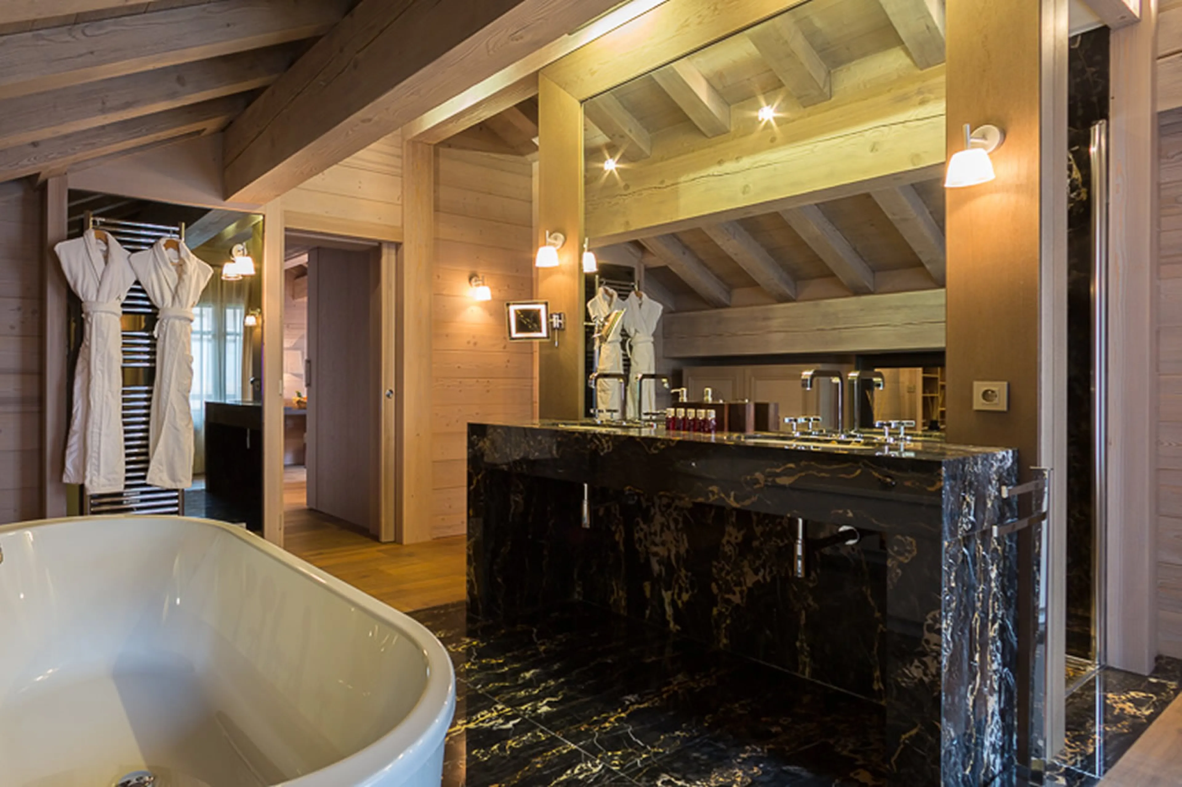 Bathroom with bath, shower and double basin in Chalet Anemone in Courchevel 1850