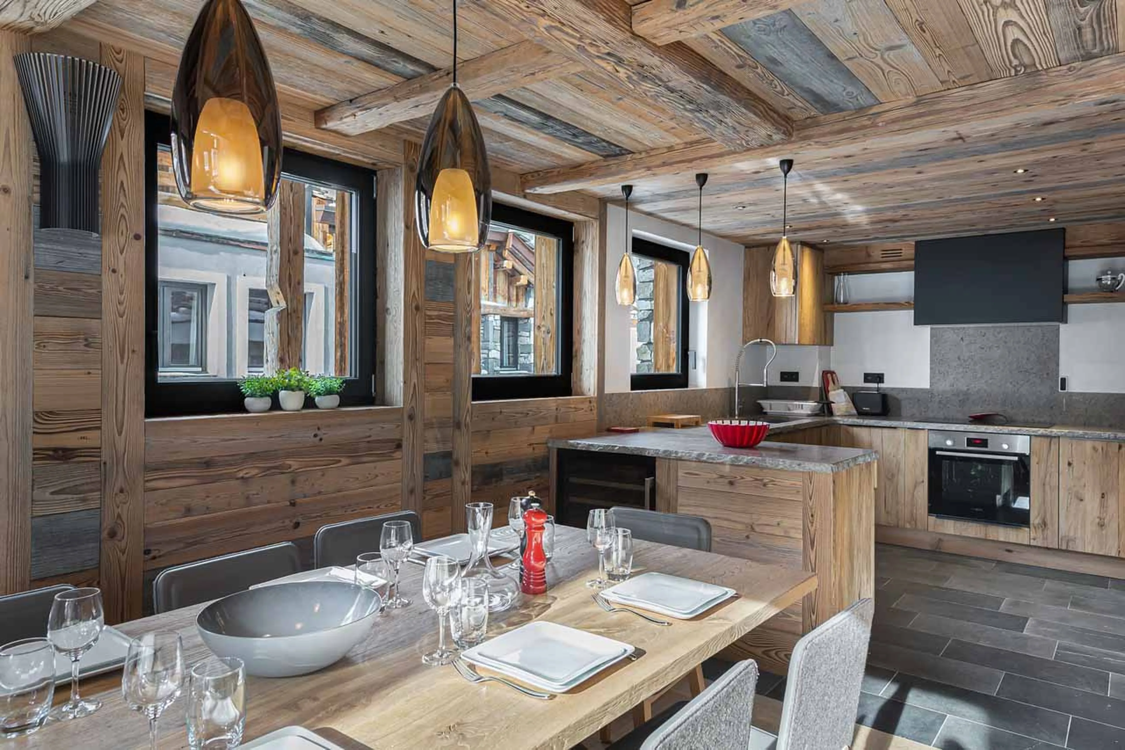 Dining area and kitchen at Chalet Angelus 1 in Val d'Isere