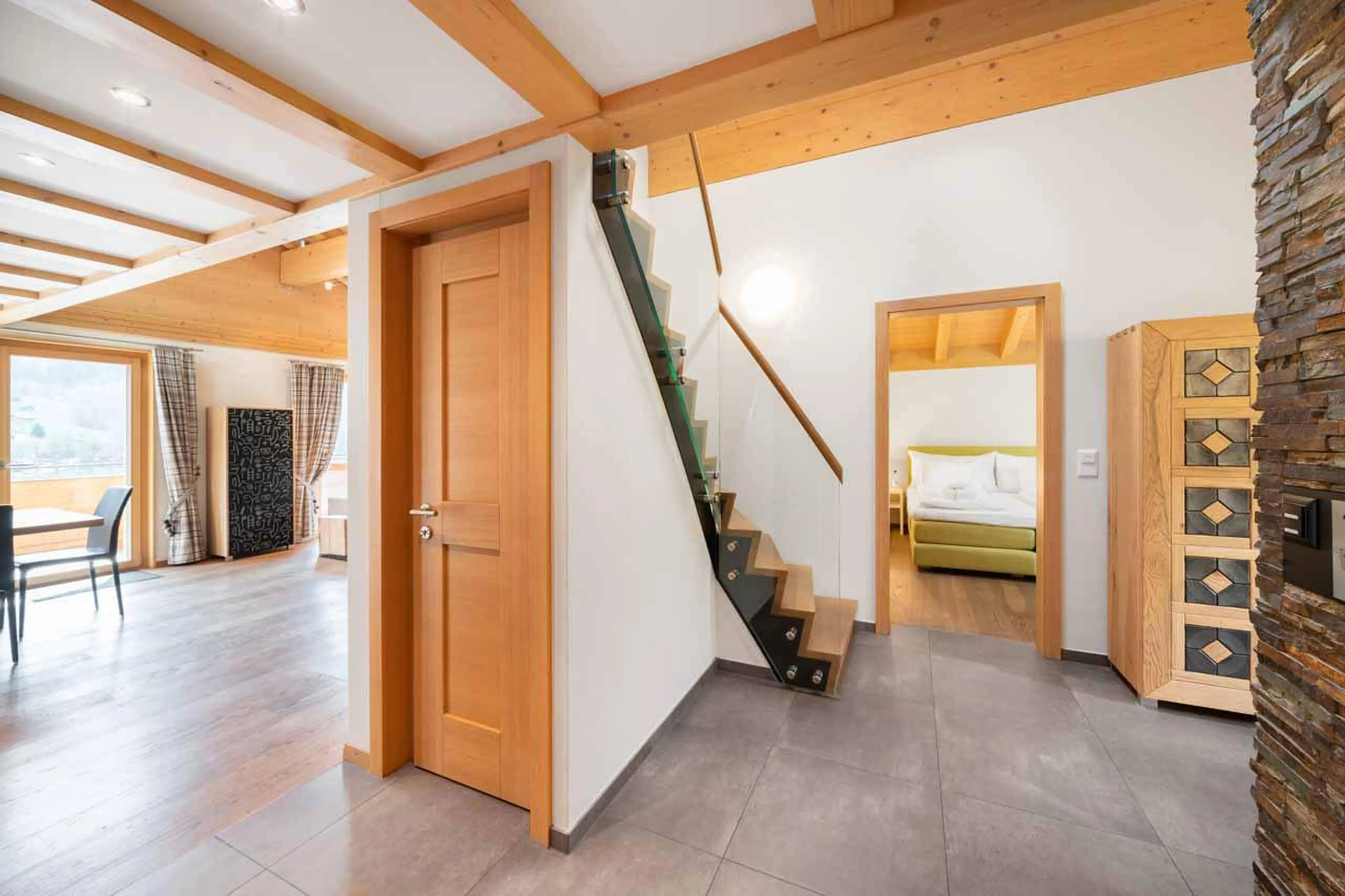 Living space with stairs leading to bedroom at Apartment Antara in Grindelwald