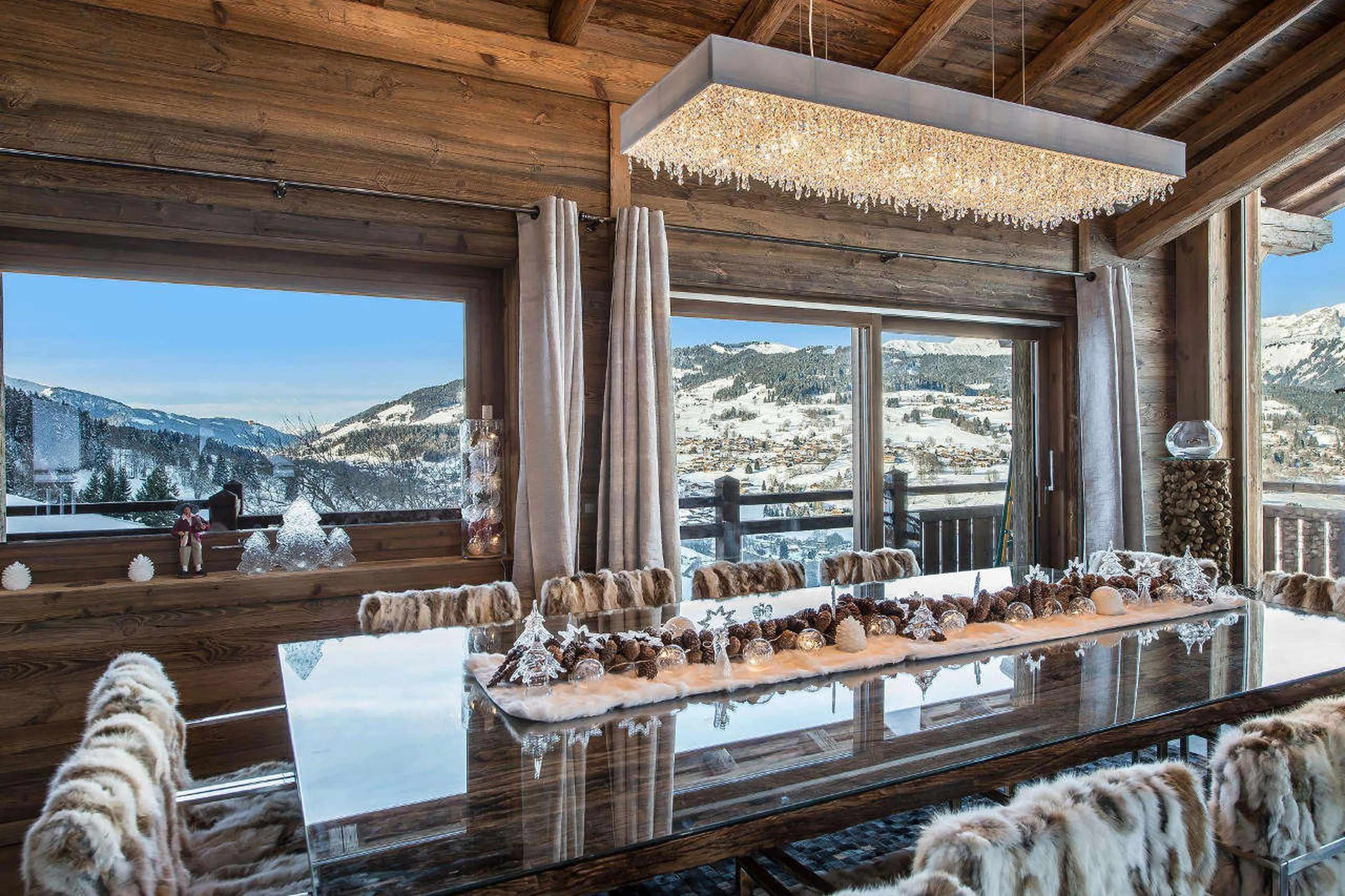 Glass table with 10 chairs in dining area in Chalet Ararat in Megeve
