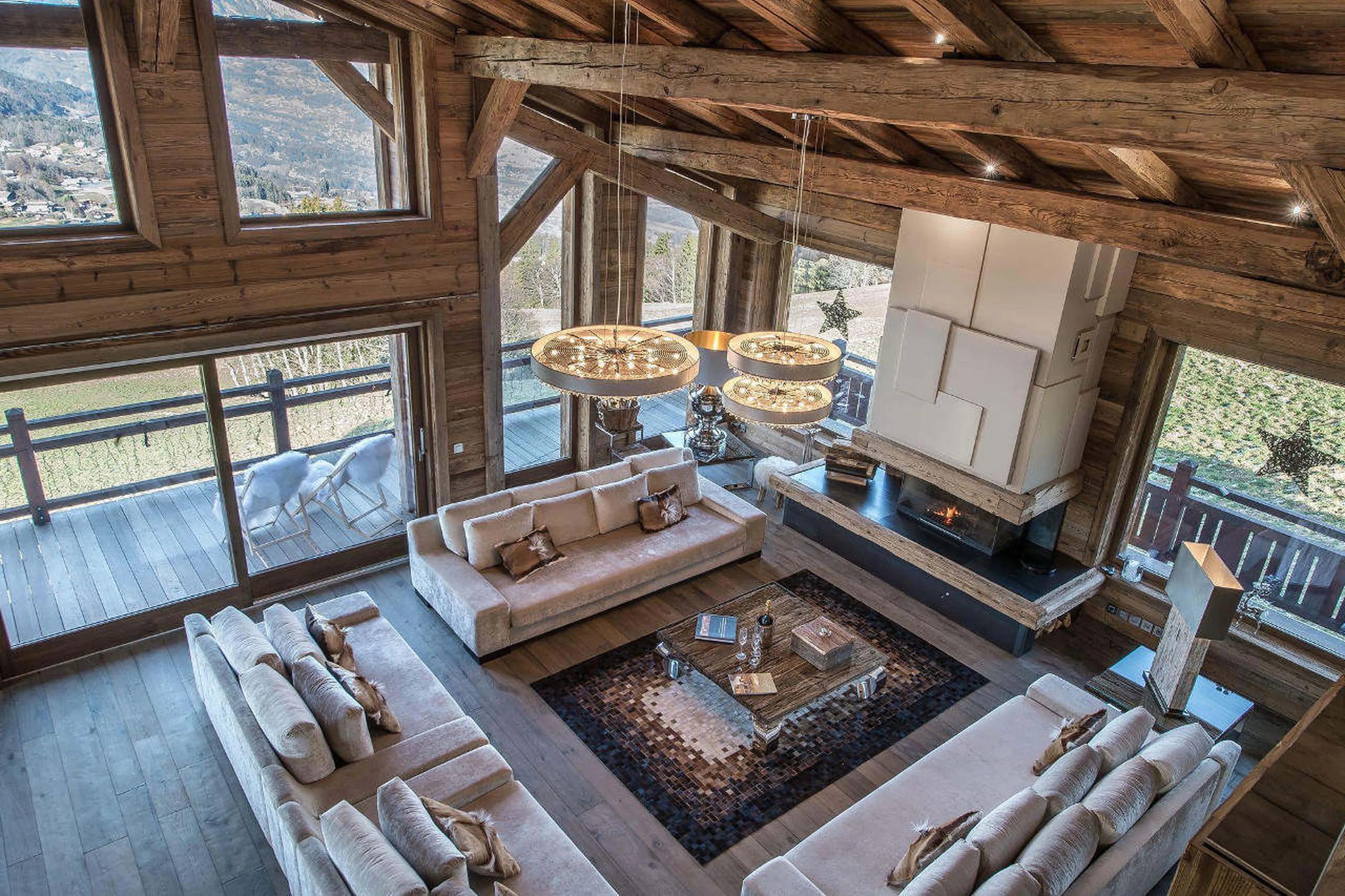 The sliding doors lead onto a furnished balcony of Chalet Ararat in Megeve