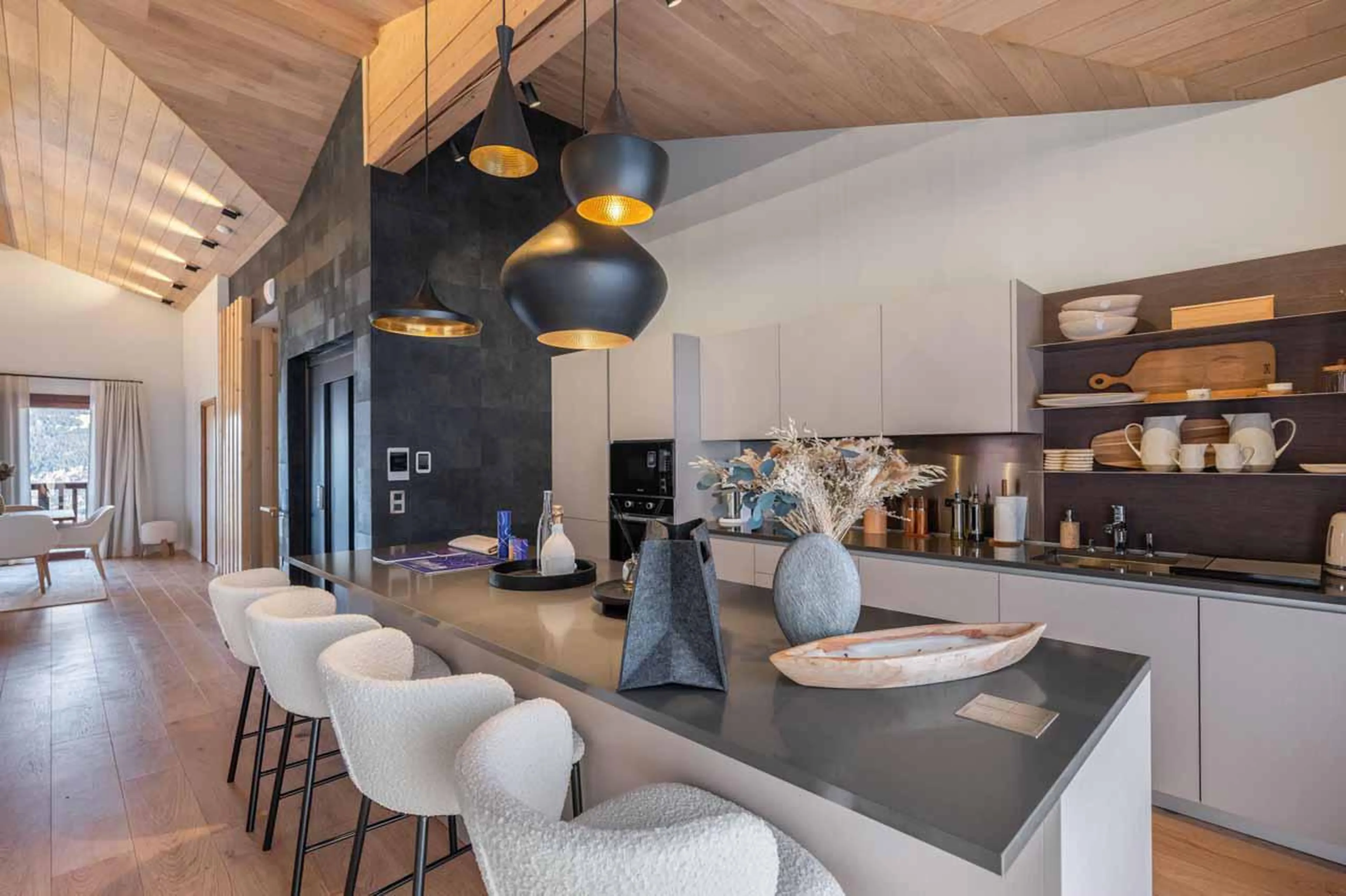Kitchen with island and high seating in Chalet Arpont, Courchevel 1650