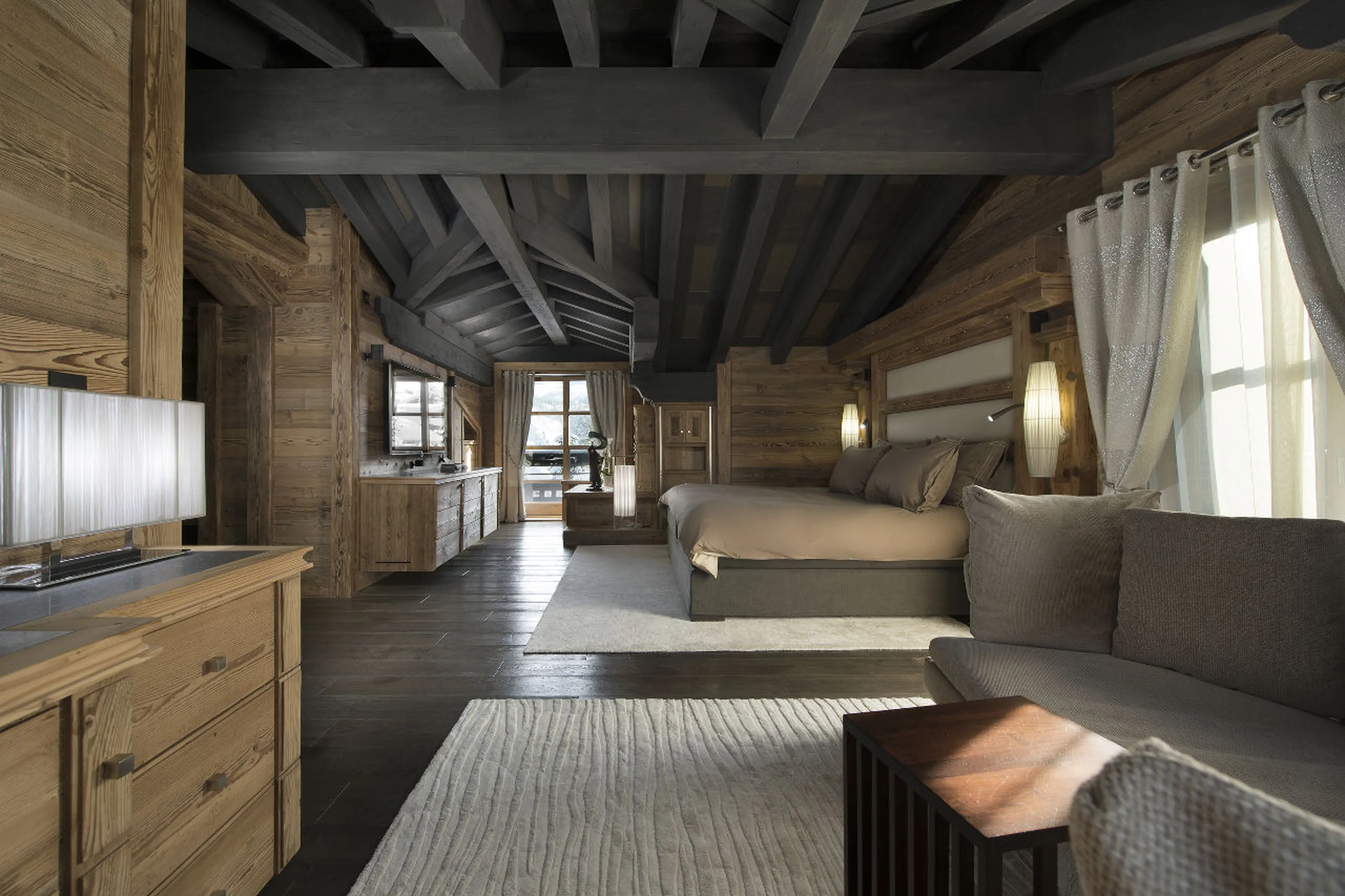 Master bedroom with king size bed, en suite, lounge and dressing room in Chalet Art in Courchevel 18