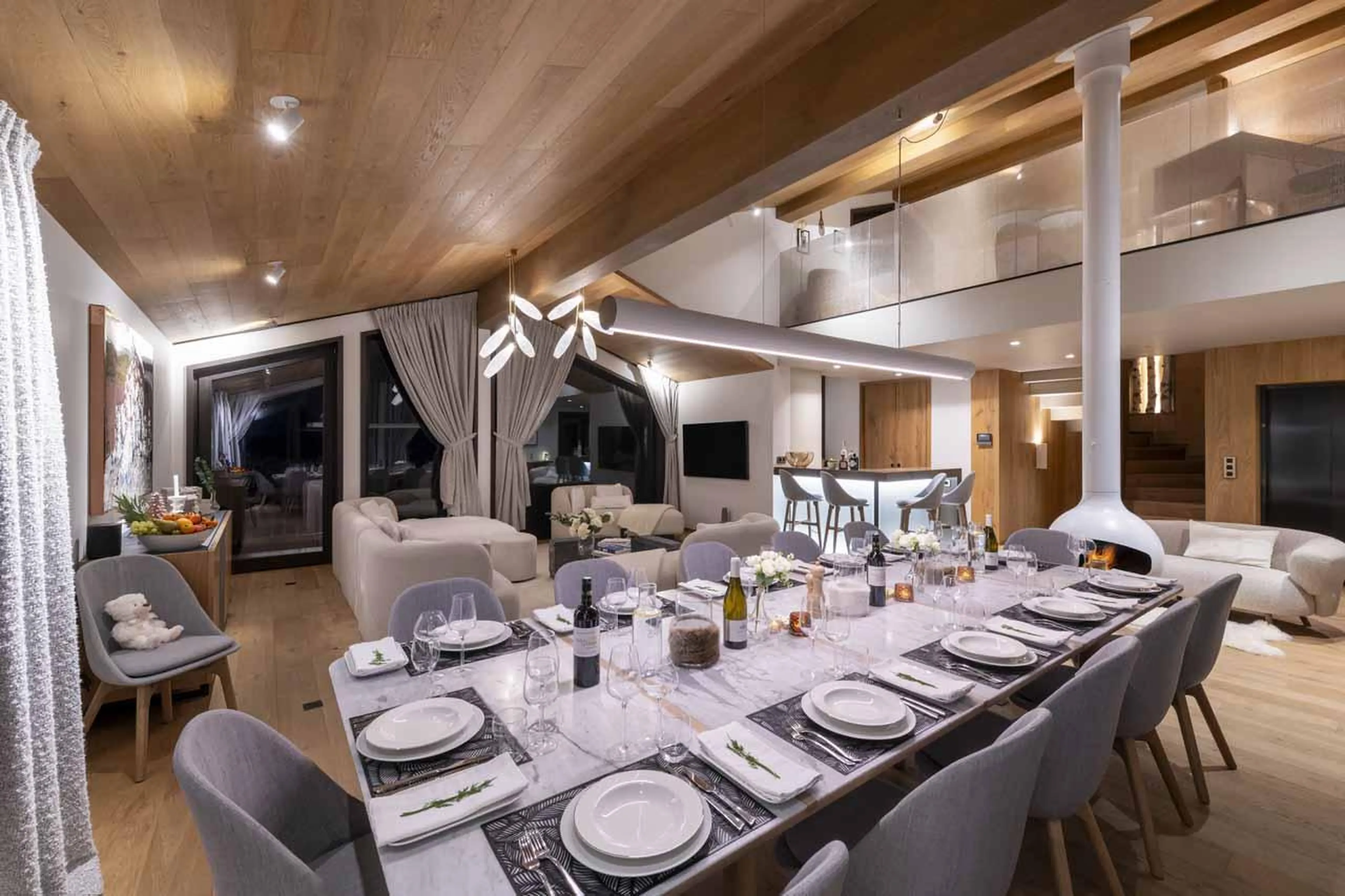 Dining table and floor-to-ceiling windows in Chalet Ascension, Courchevel 1650