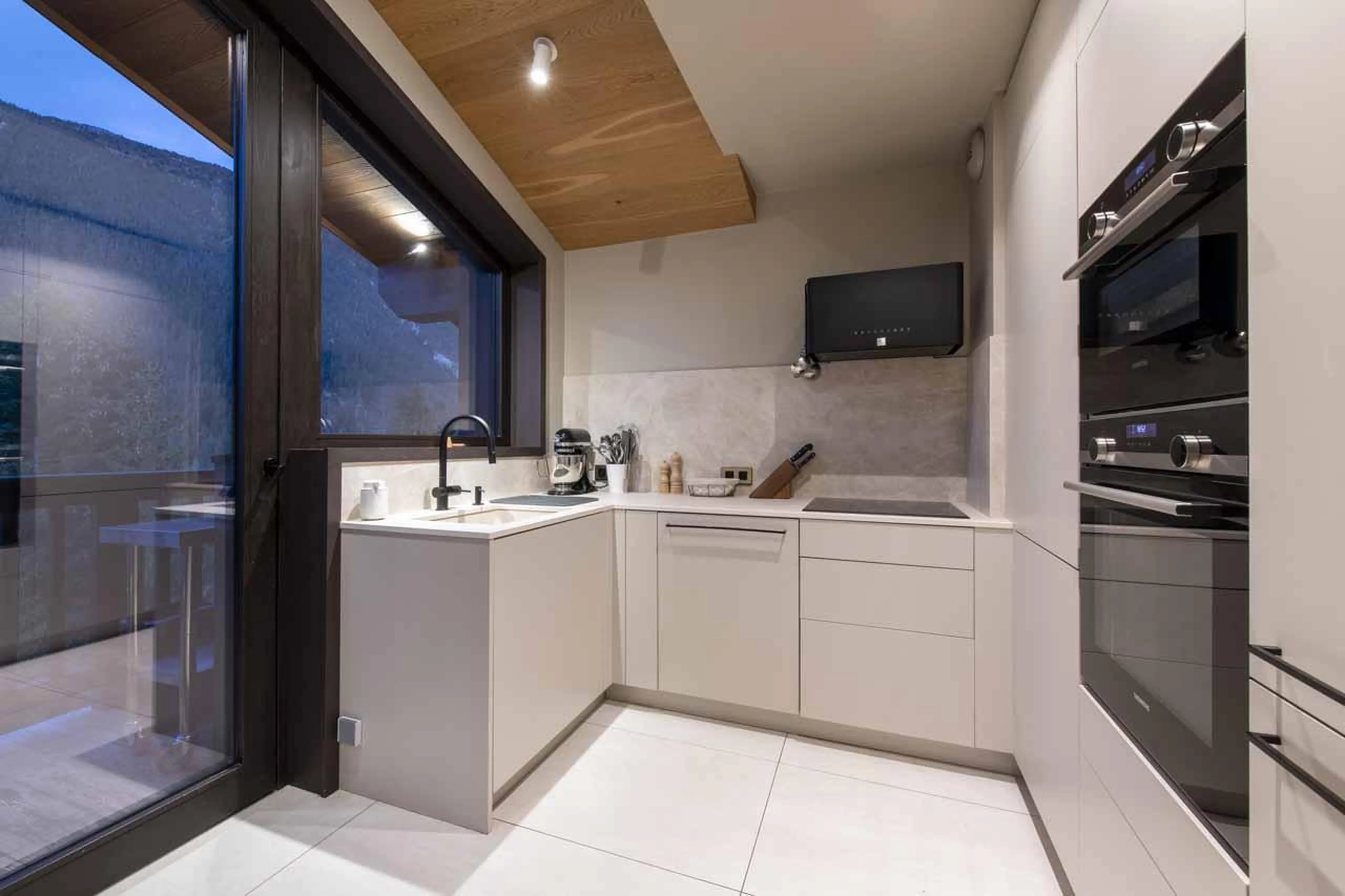 Kitchen with floor-to-ceiling windows in Chalet Ascension, Courchevel 1650