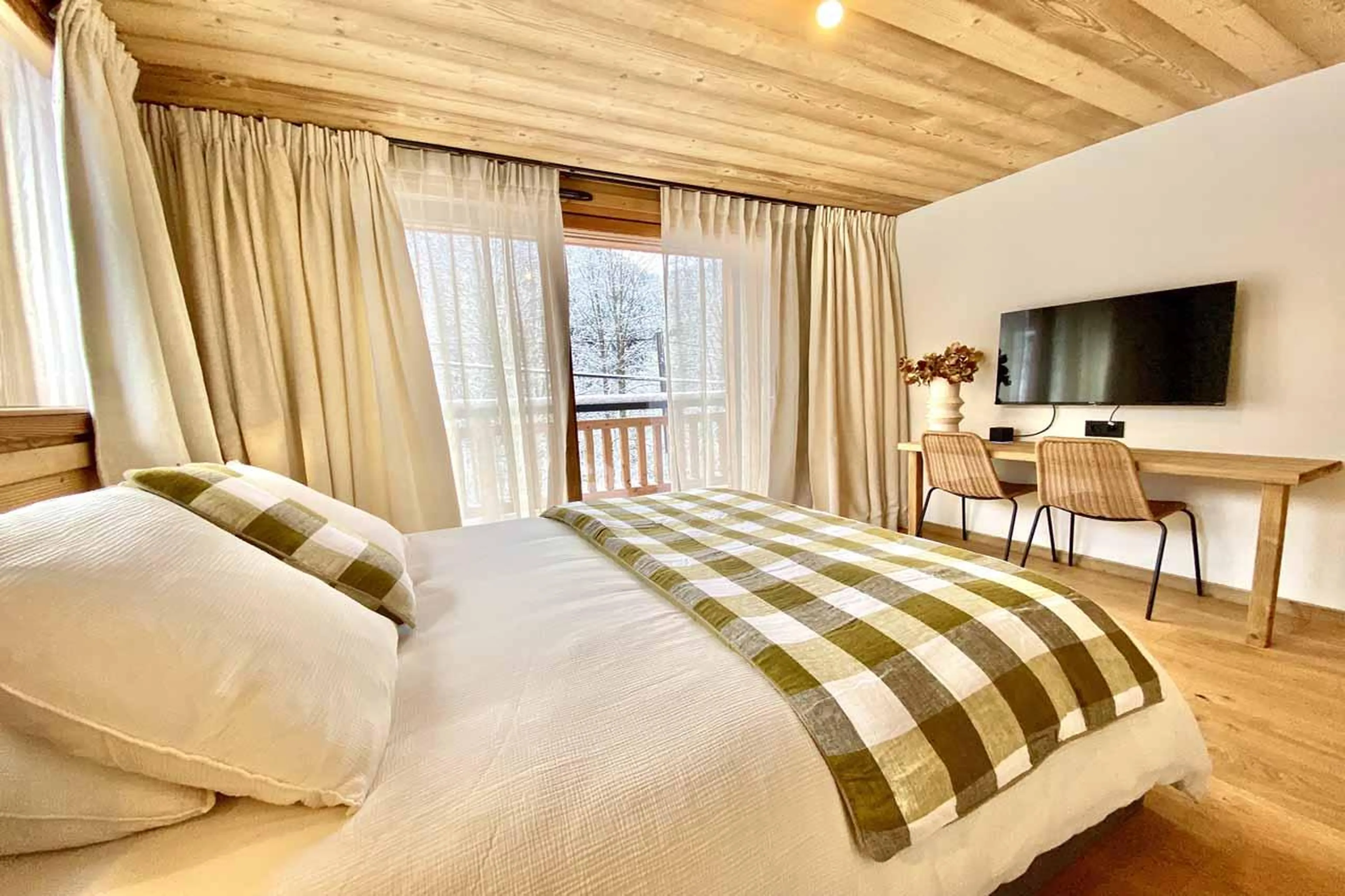 Double bedroom with TV and desk in Chalet Asgard, Morzine