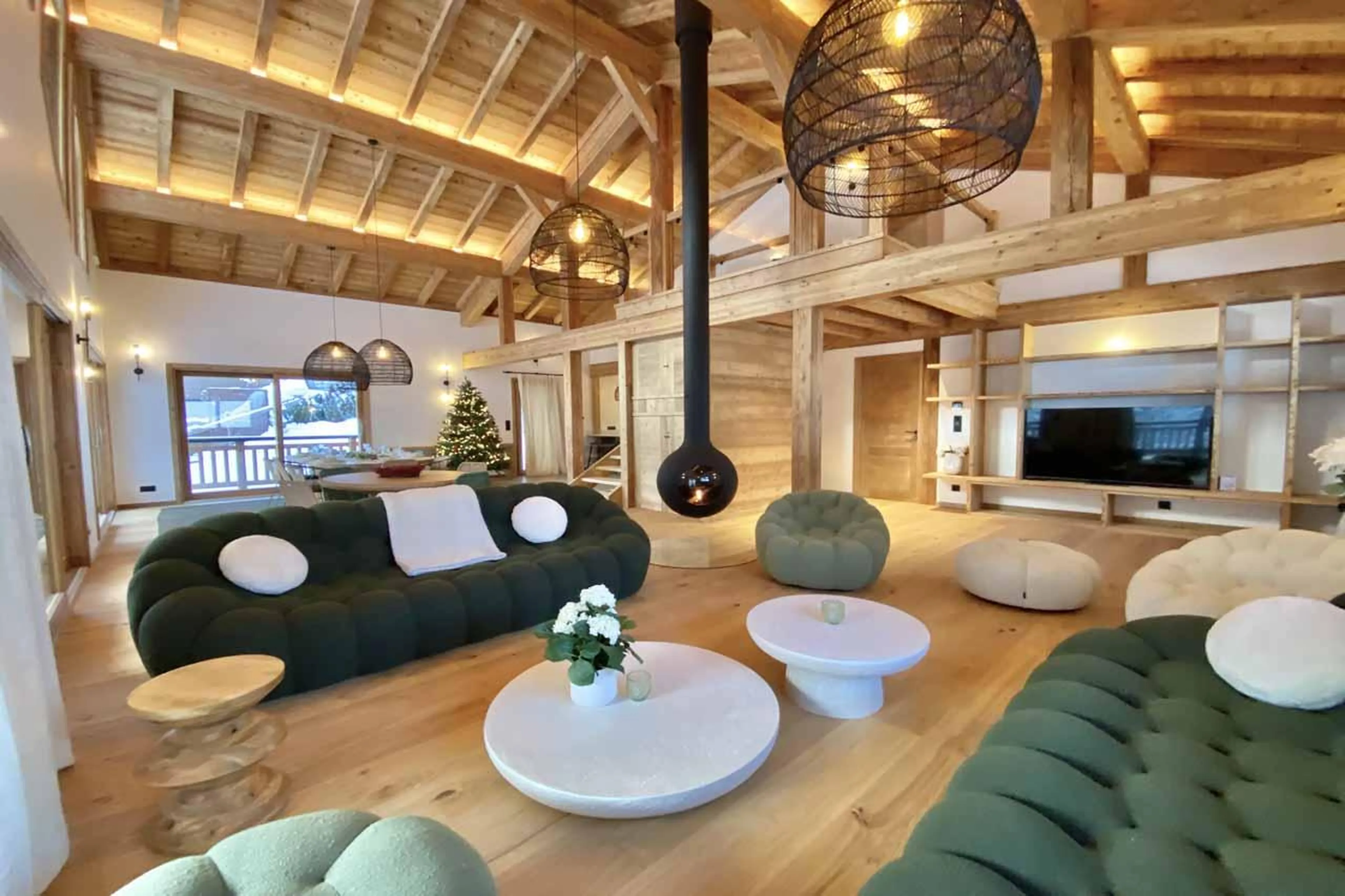 Sofas and hanging fireplace in Chalet Asgard, Morzine