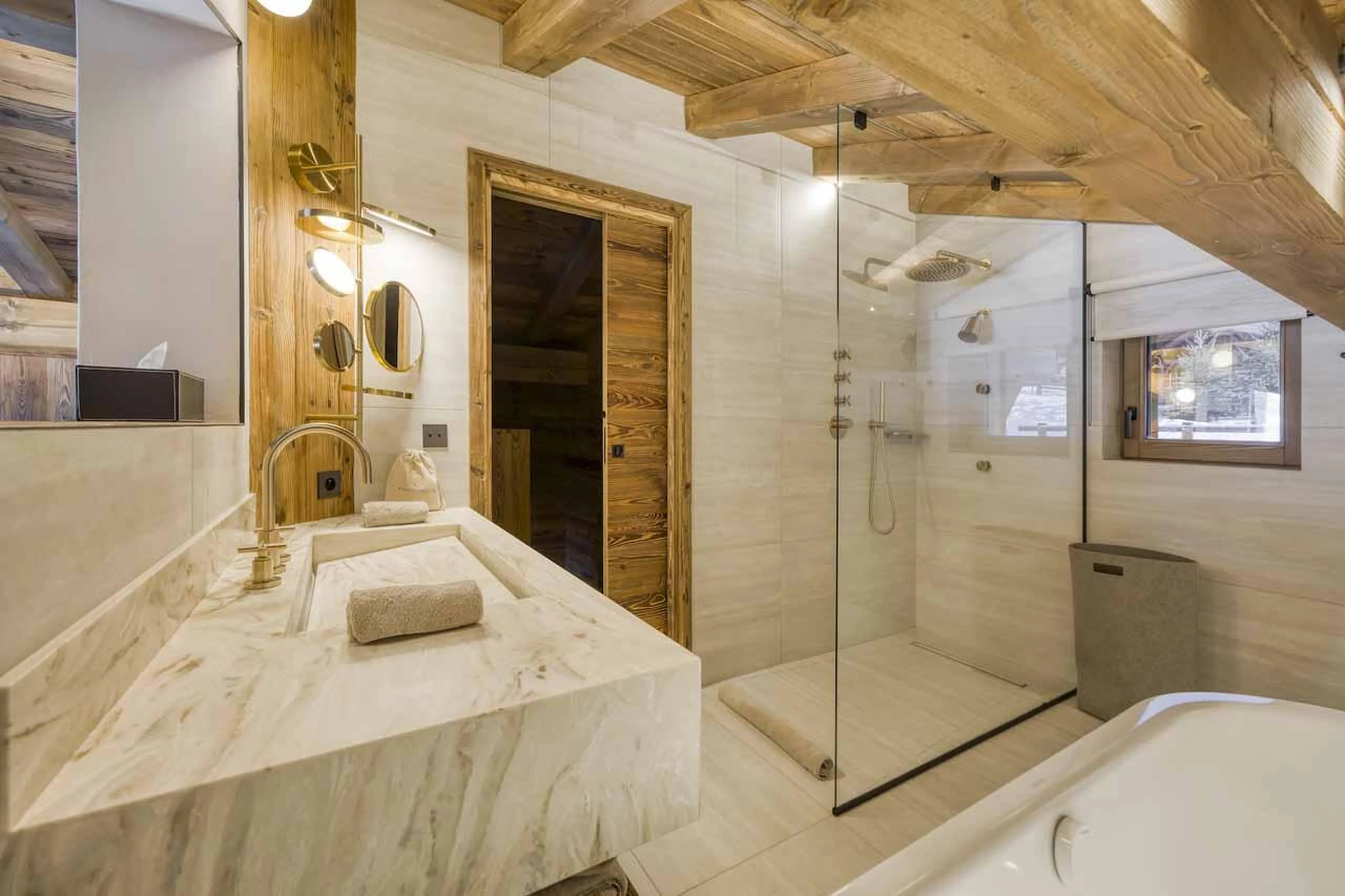En-suite bathroom with separate shower and basin in Chalet Aspen, Megeve