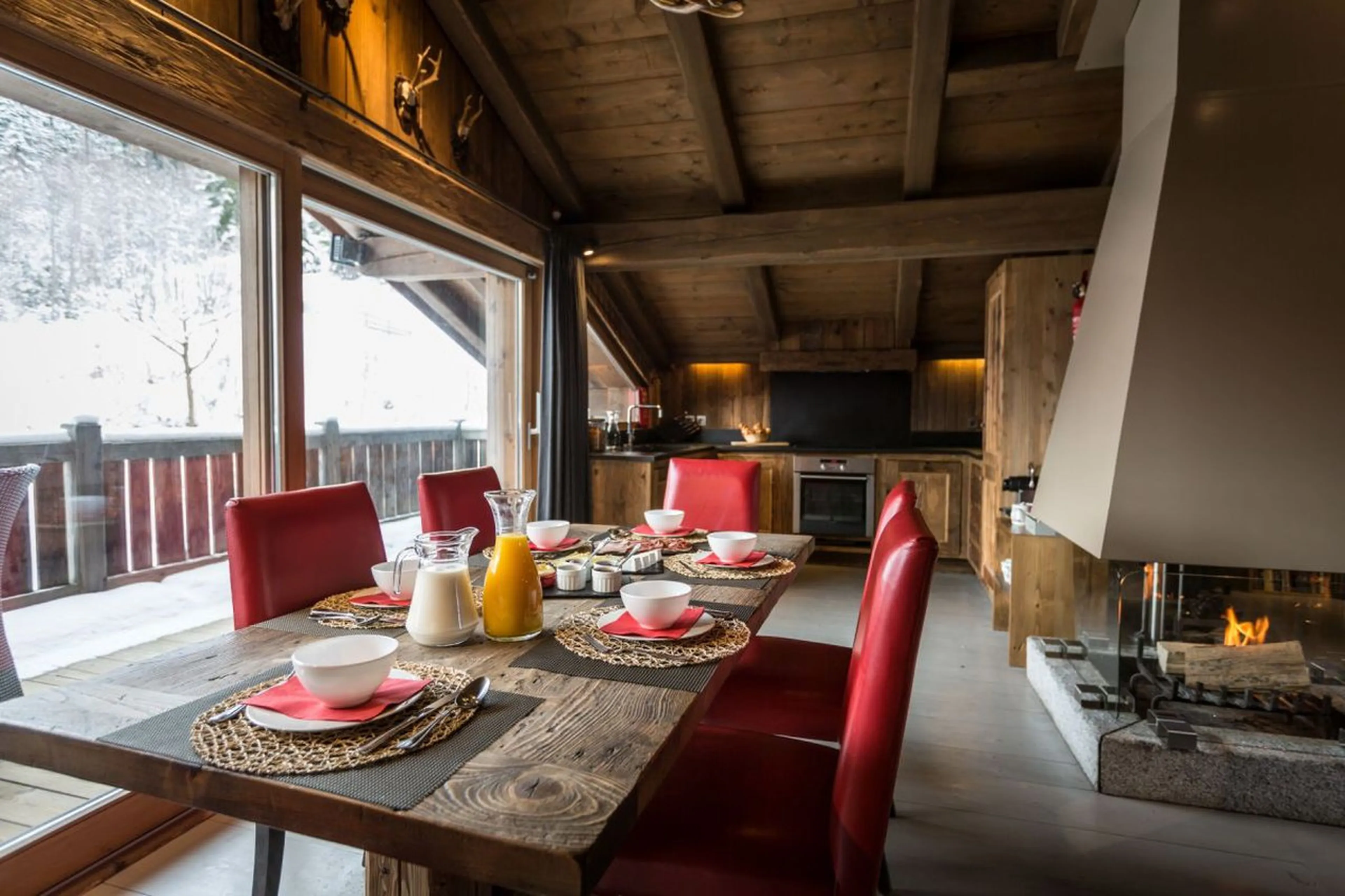 Dining area with balcony access at Chalet Baby Bear in Chamonix