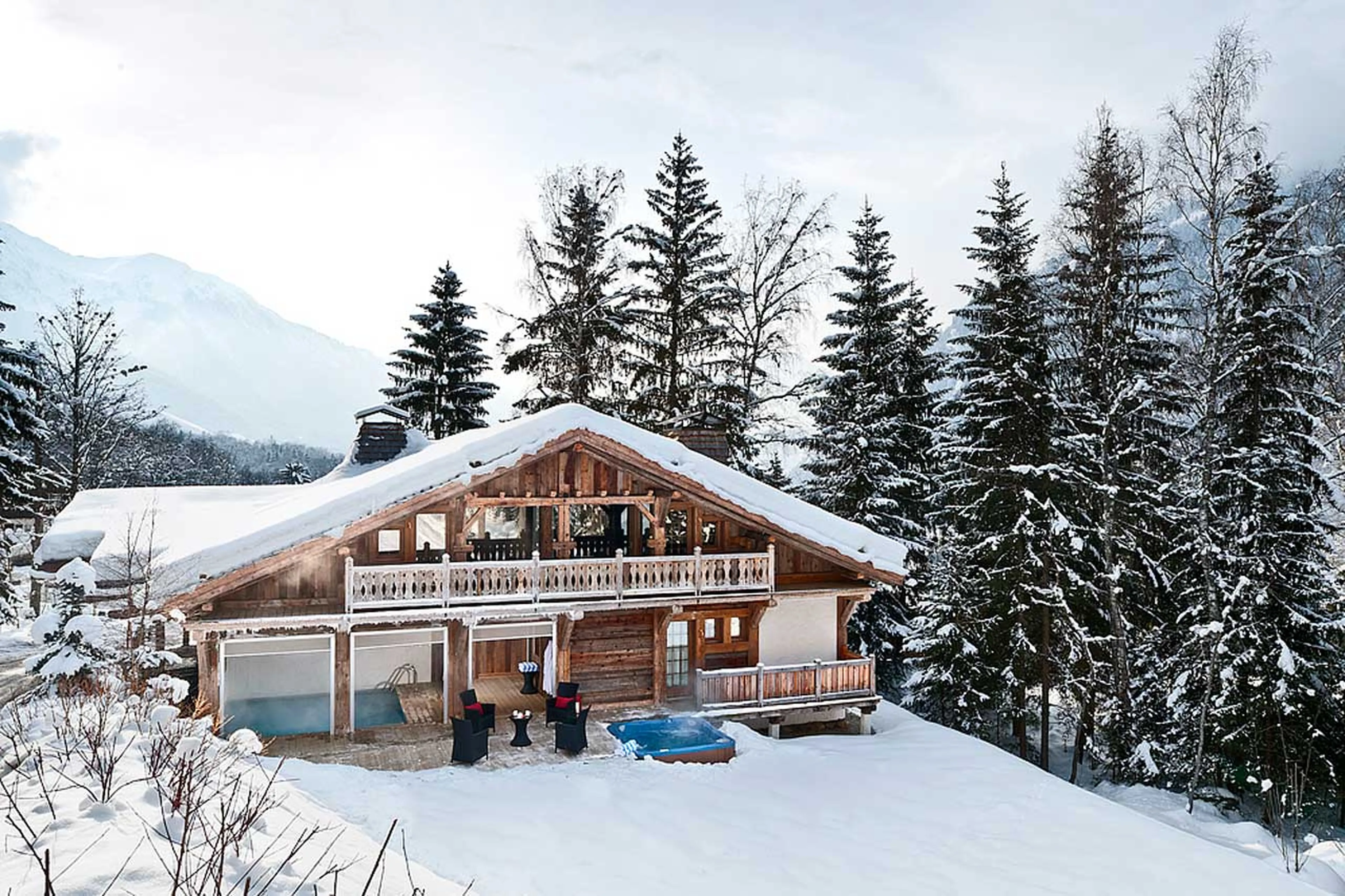 Exterior of Chalet Baloo in Chamonix  in winter, surrounded by woodland