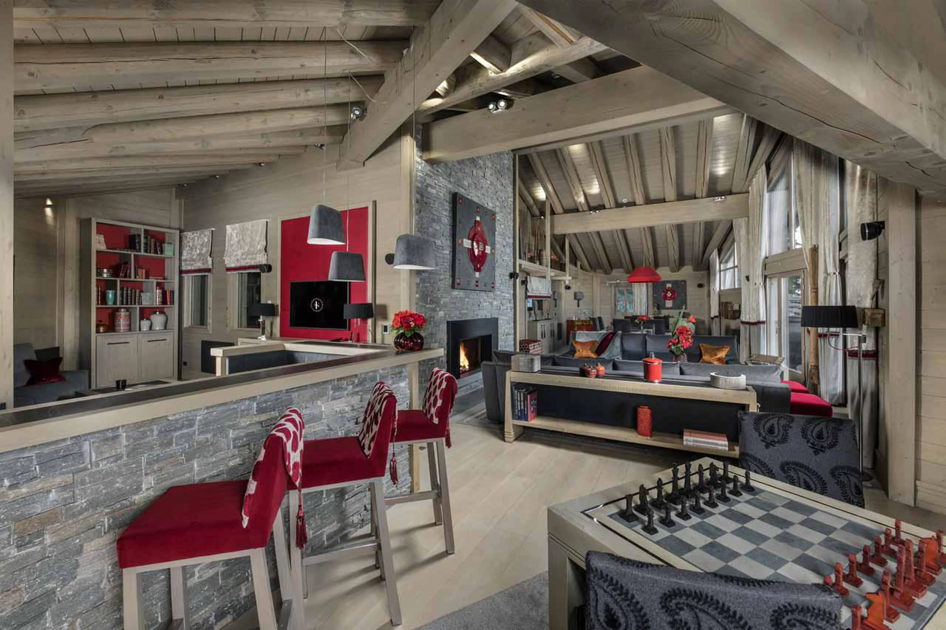 Living area with bar seating at Chalet Baltoro in Courchevel 1850