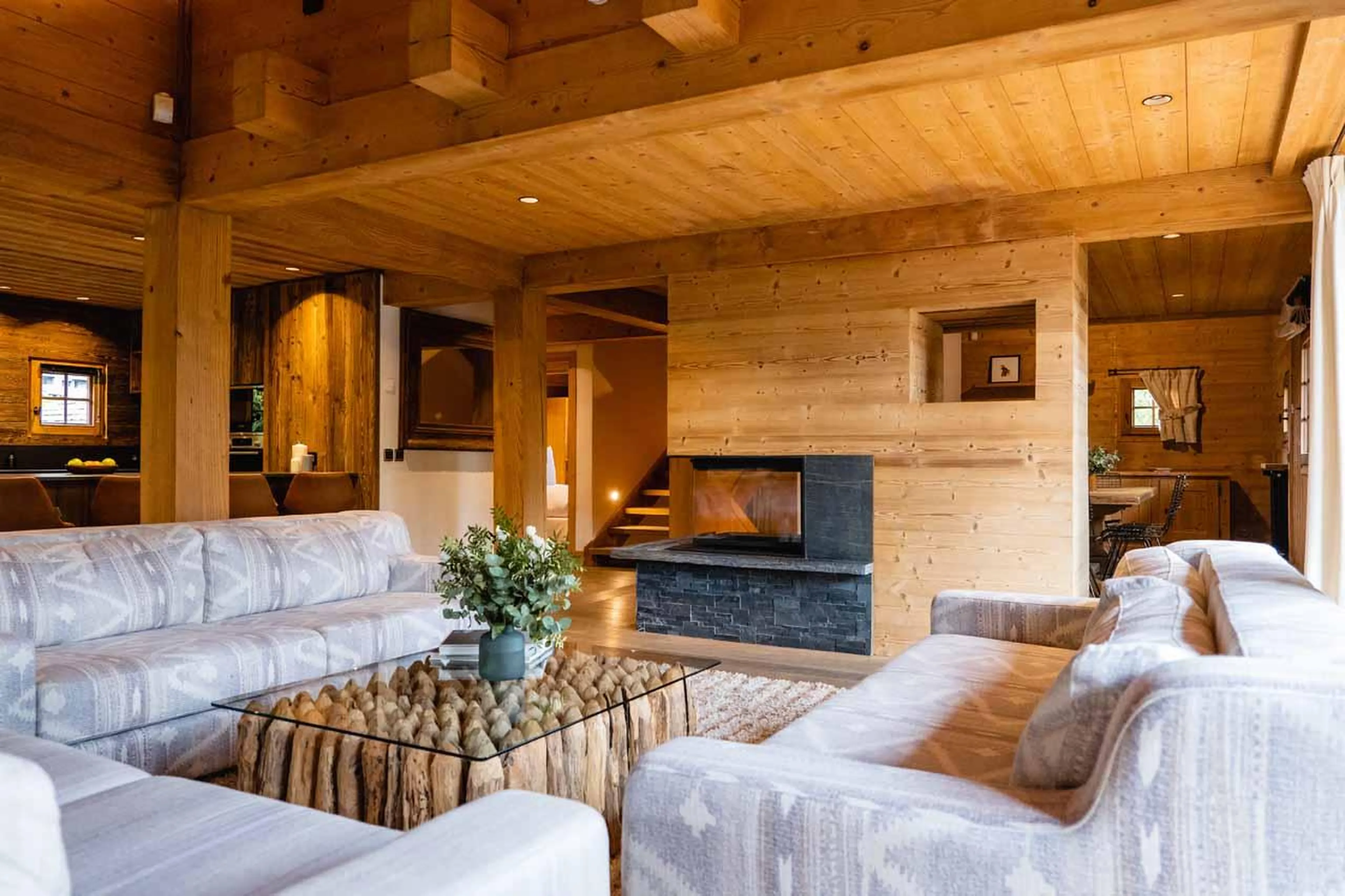 Sofas, coffee table and fireplace in Chalet Baltus, Megeve