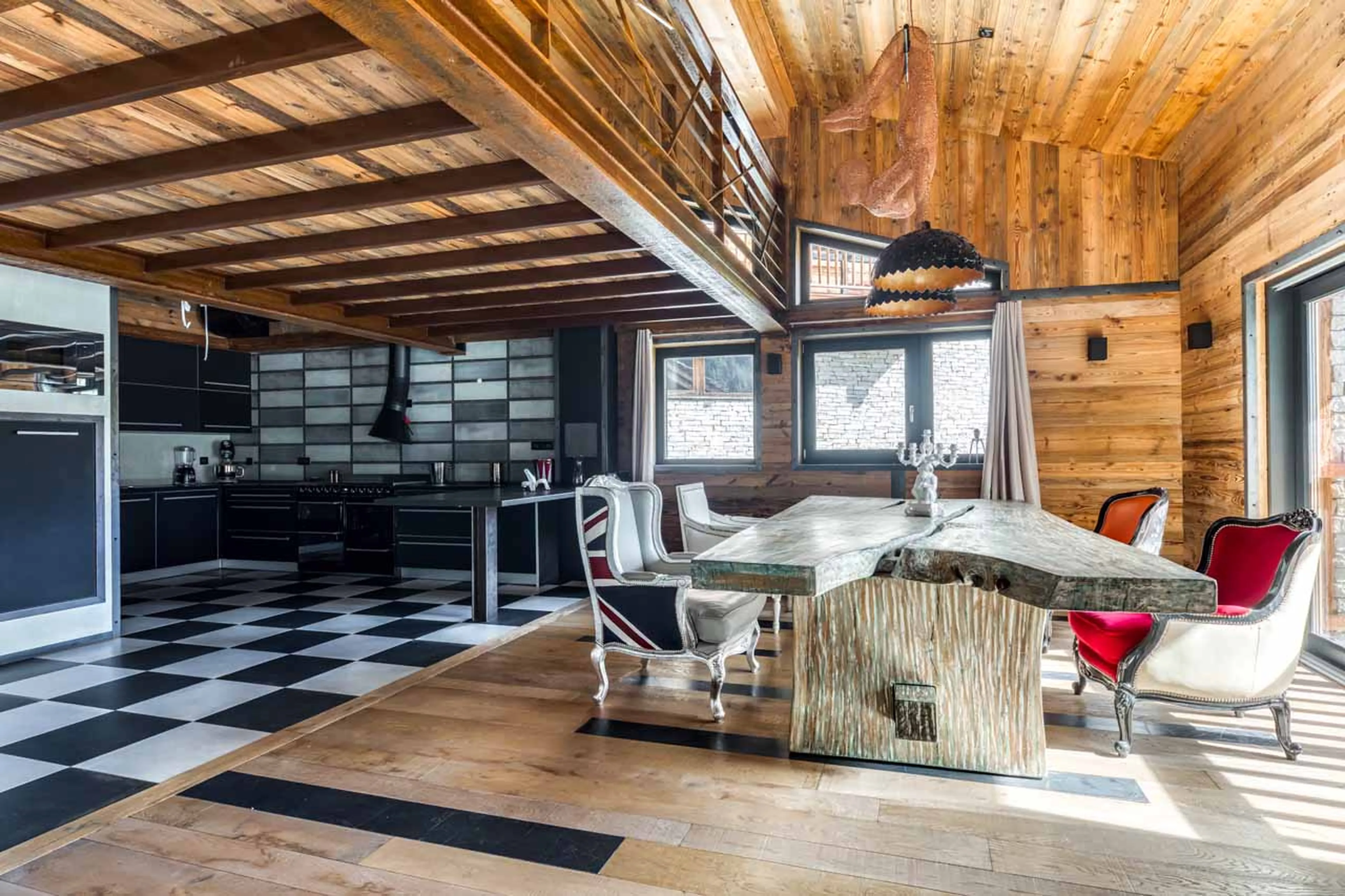 Dining table and kitchen at Chalet Banksy in Tignes