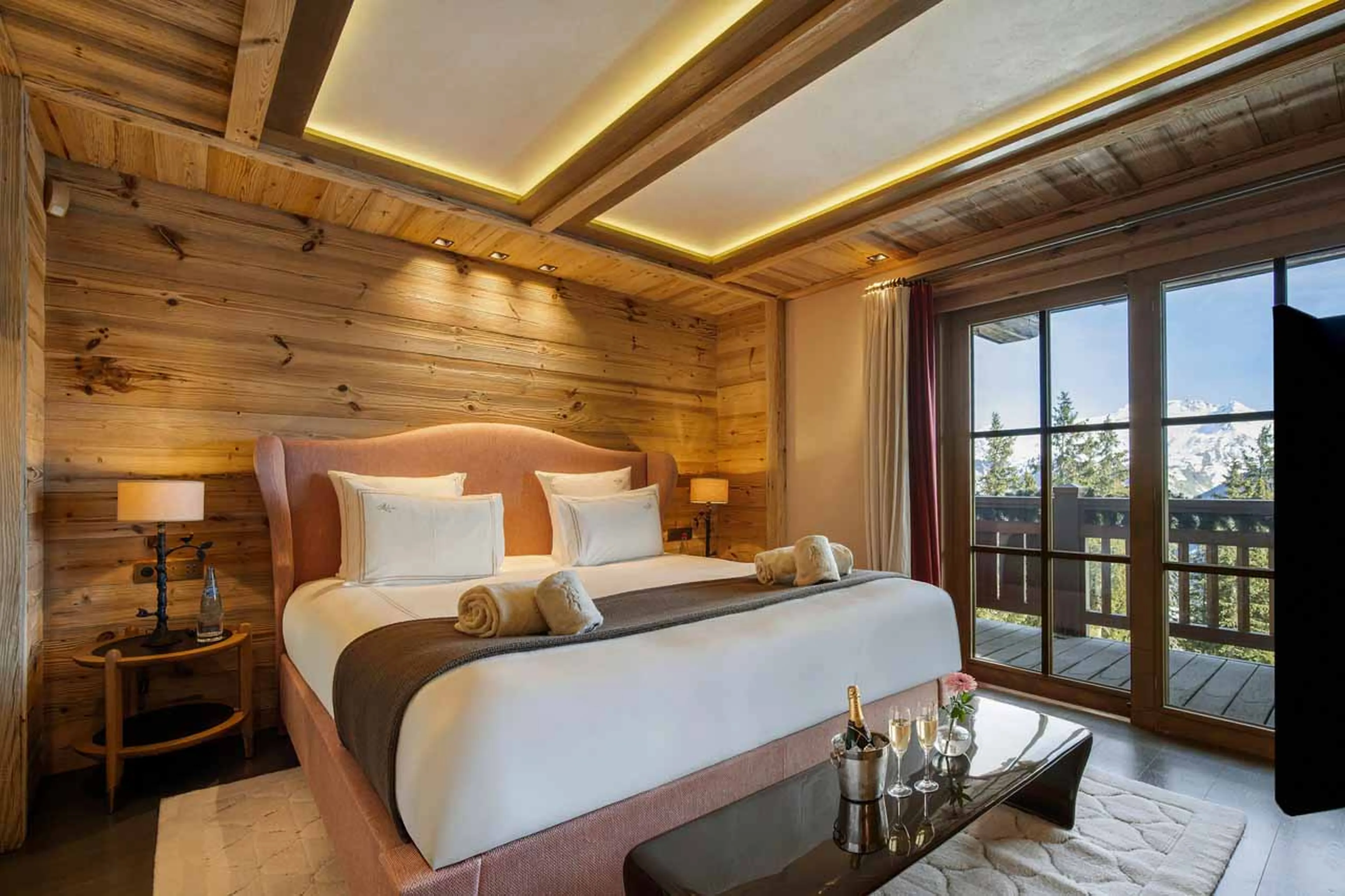 Master bedroom suite with balcony access in Chalet Les Bastidons in Courchevel 1850