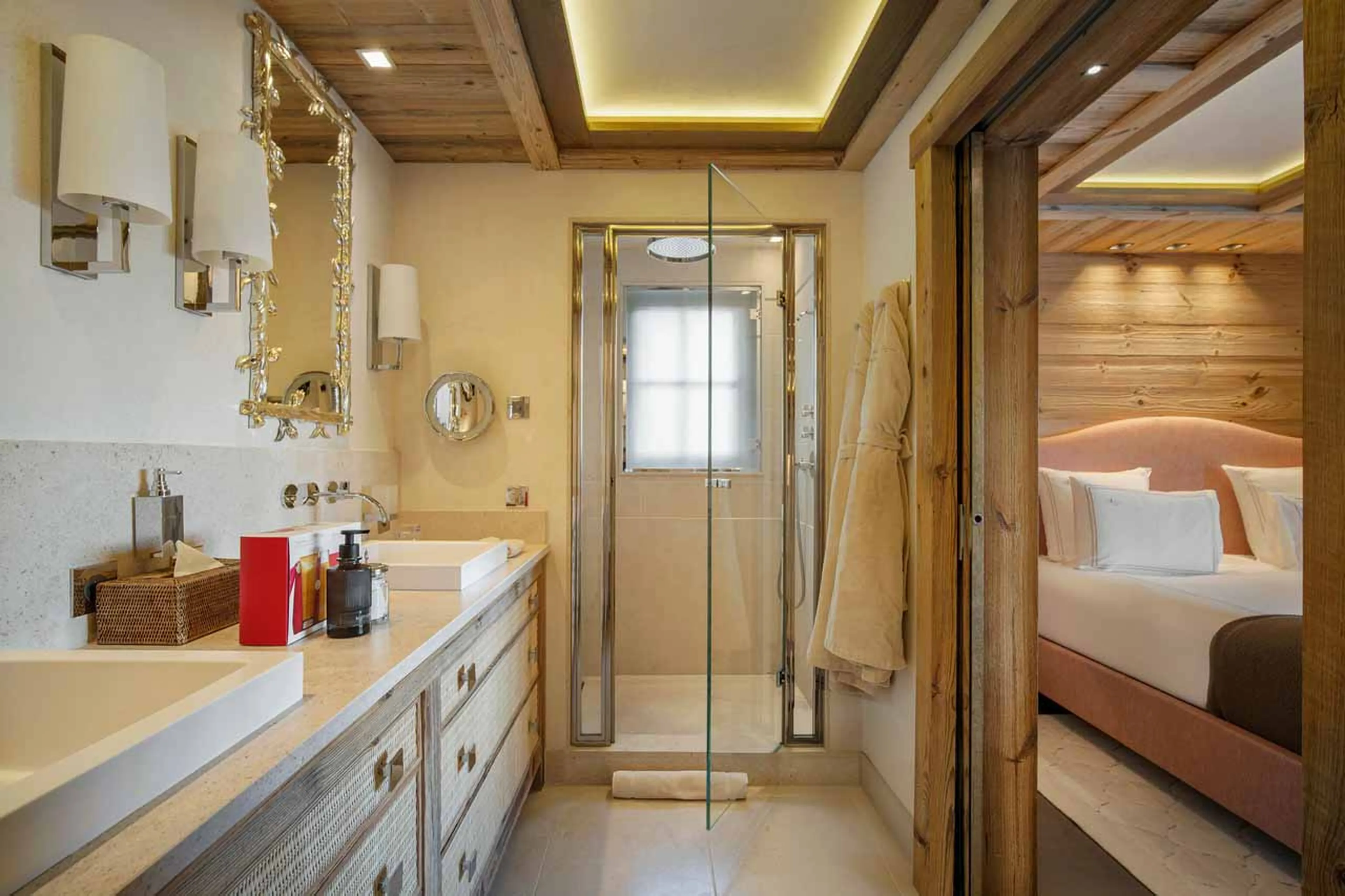 En suite master bedroom with king-size bed in Chalet Les Bastidons  in Courchevel 1850