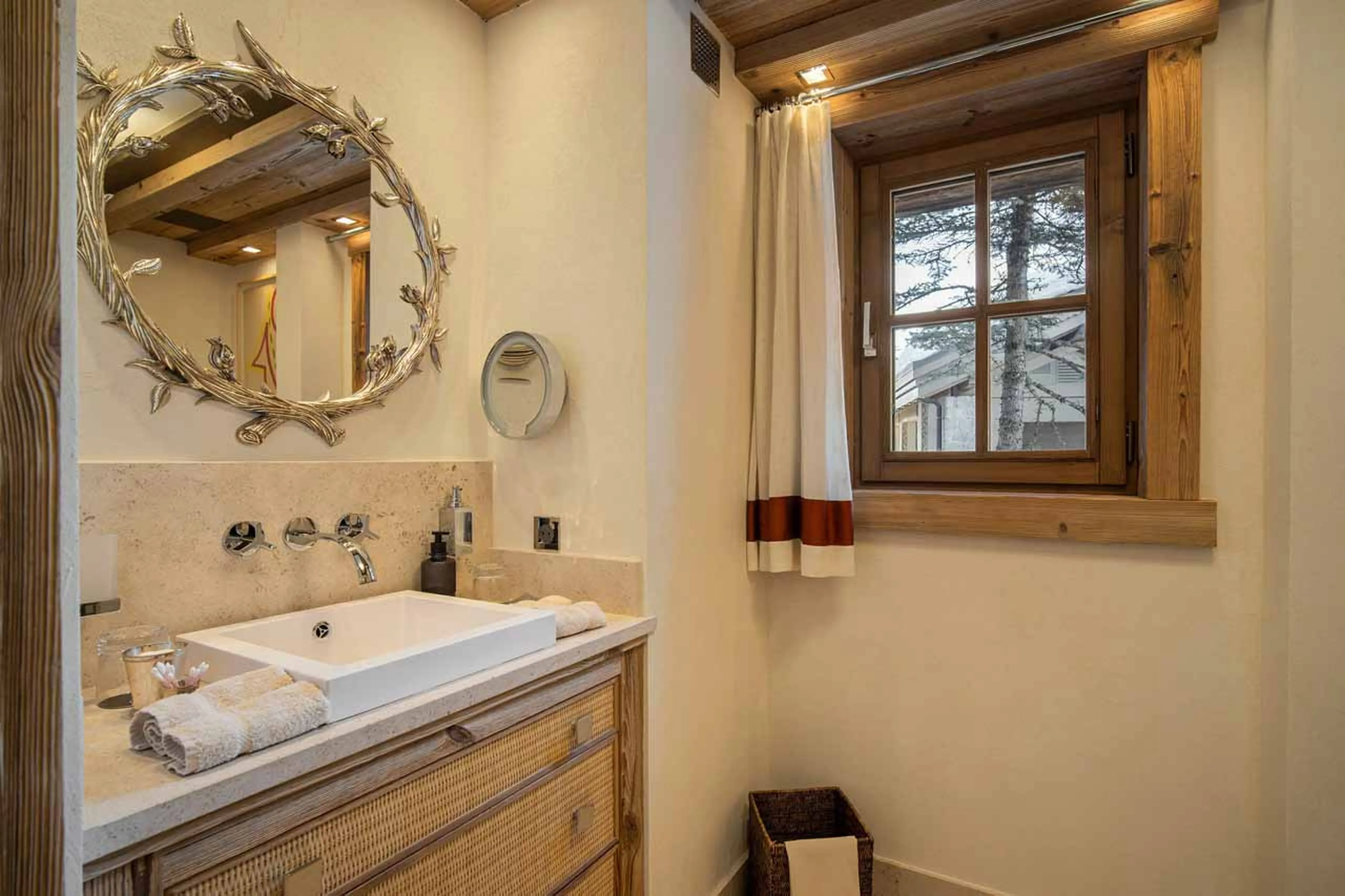 Double bedroom with dressing area and vanity corner in Chalet Les Bastidons  in Courchevel 1850