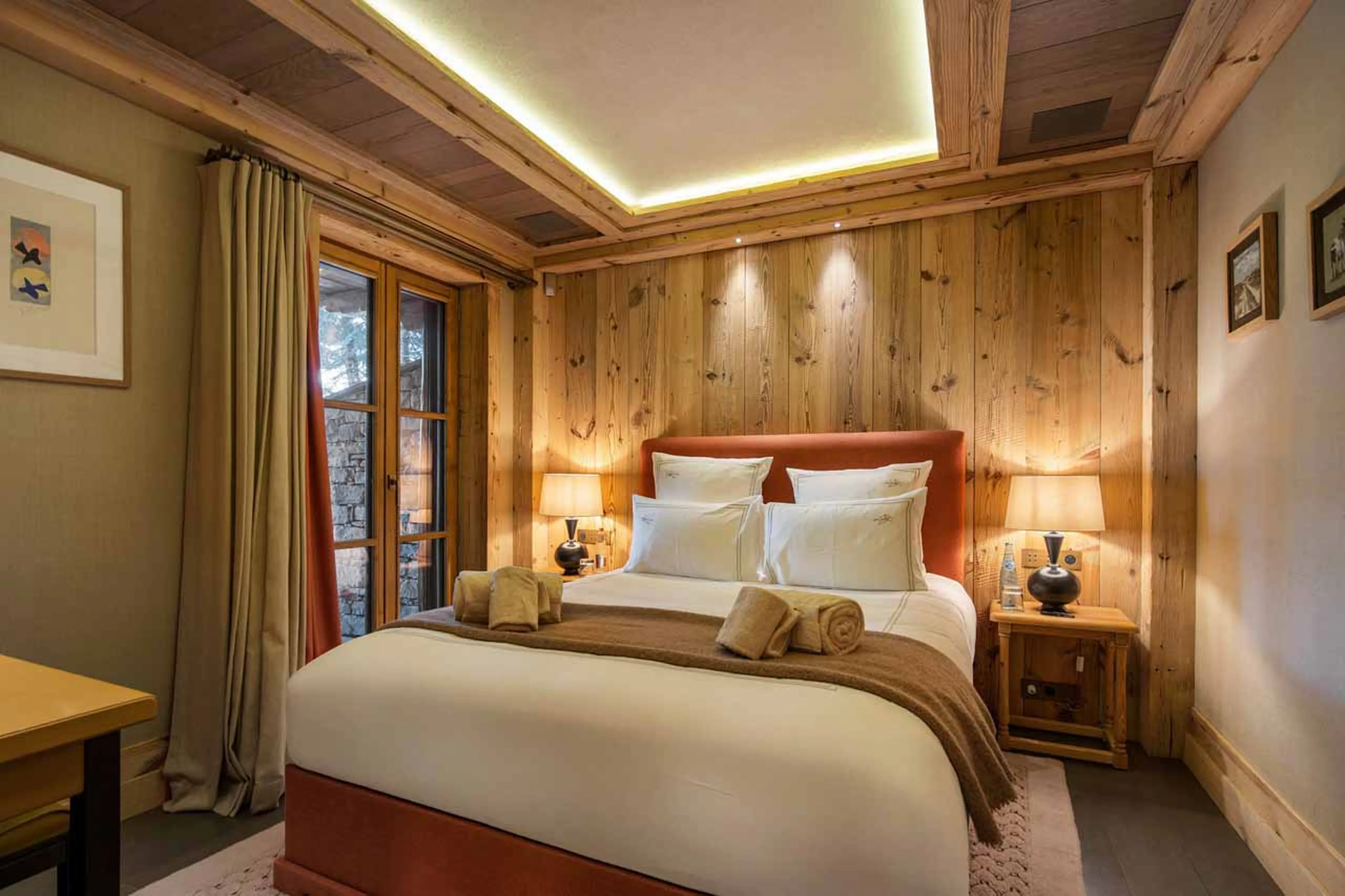 En suite double bedroom open to the terrace in Chalet Les Bastidons  in Courchevel 1850