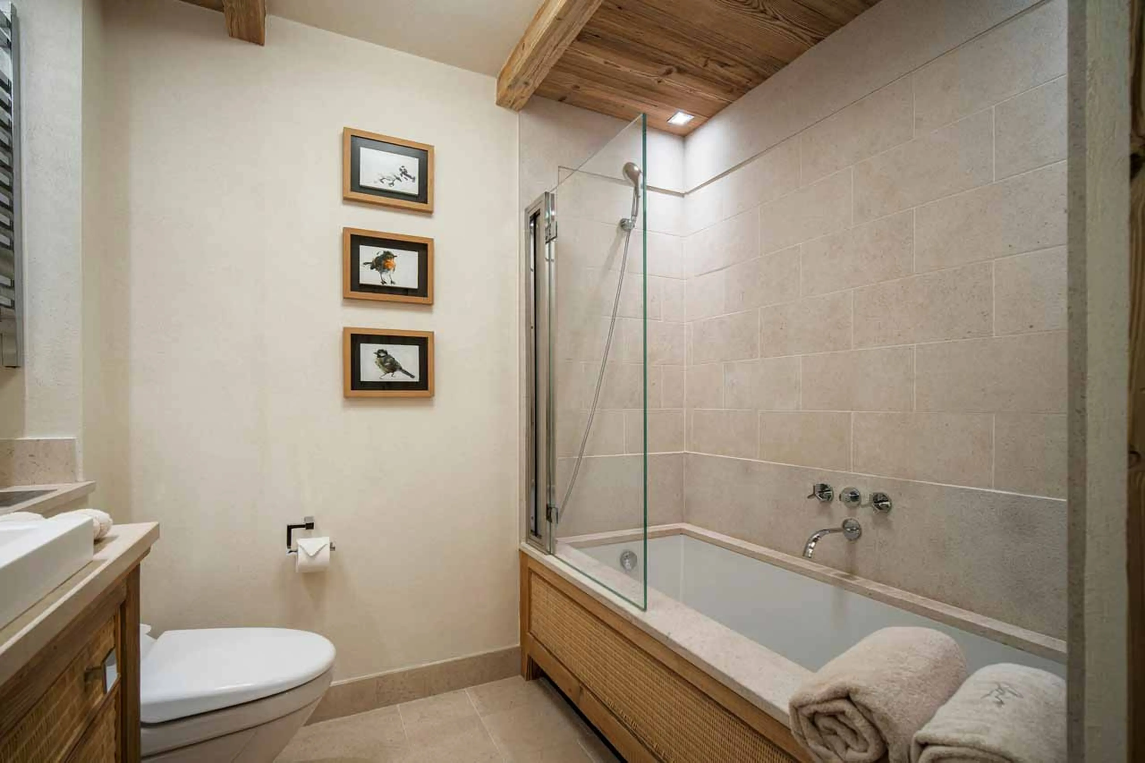 En suite bathroom connected to double bedroom in Chalet Les Bastidons  in Courchevel 1850