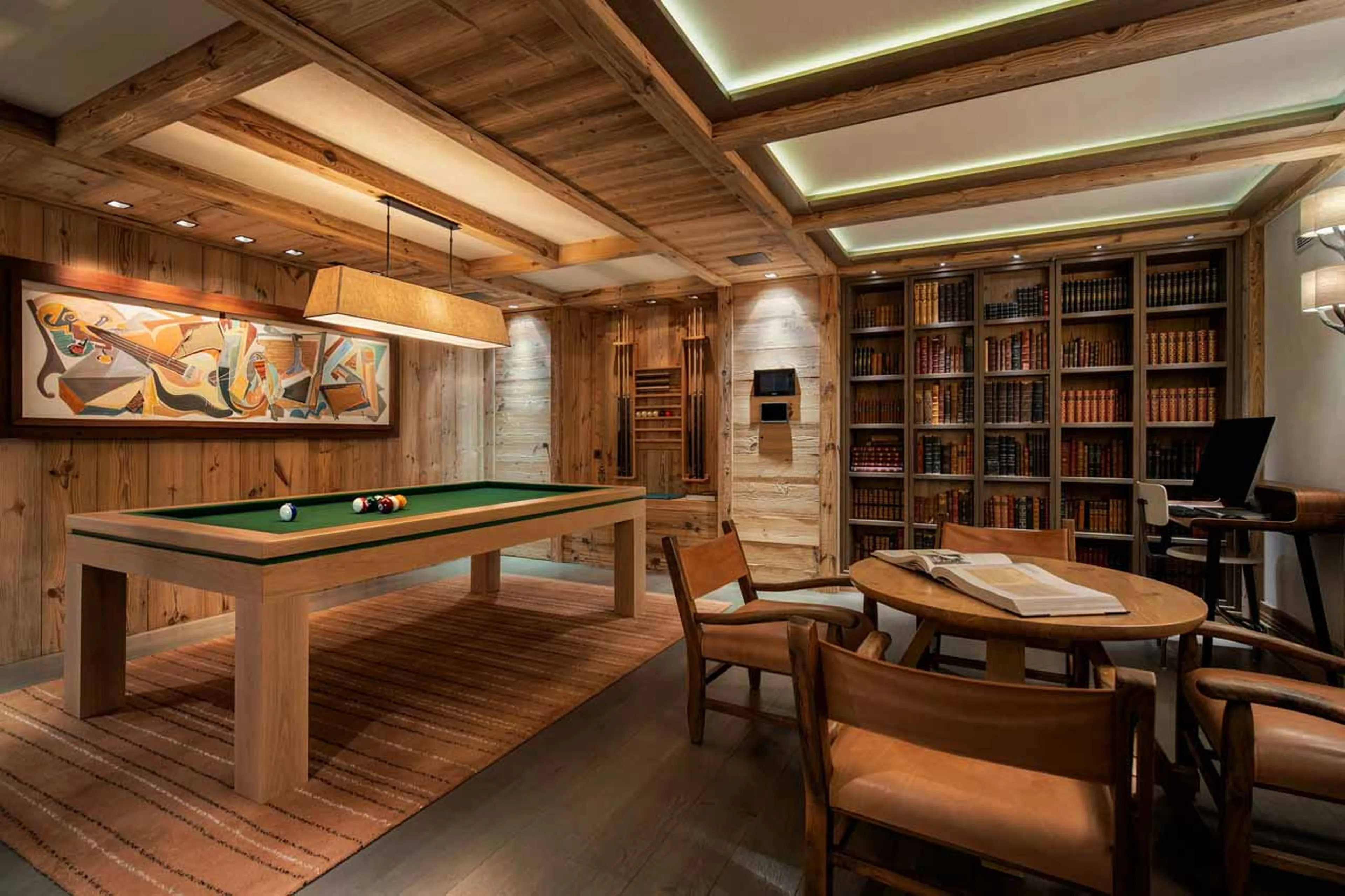 Books, piano and pool table in games room of Chalet Les Bastidons  in Courchevel 1850