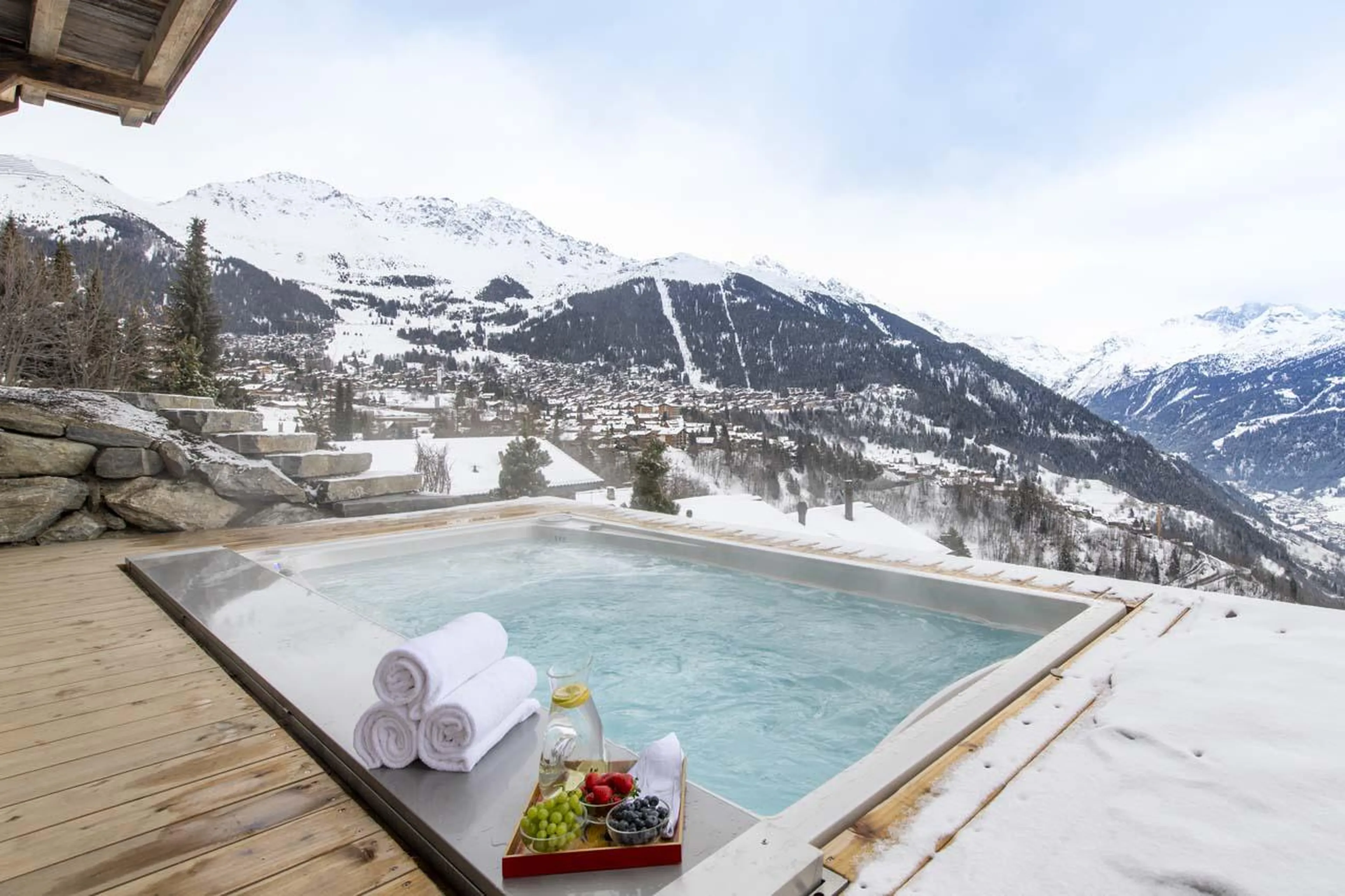 Outdoor hot tub overlooking spectacular mountain views at Chalet Bavaria in Verbier
