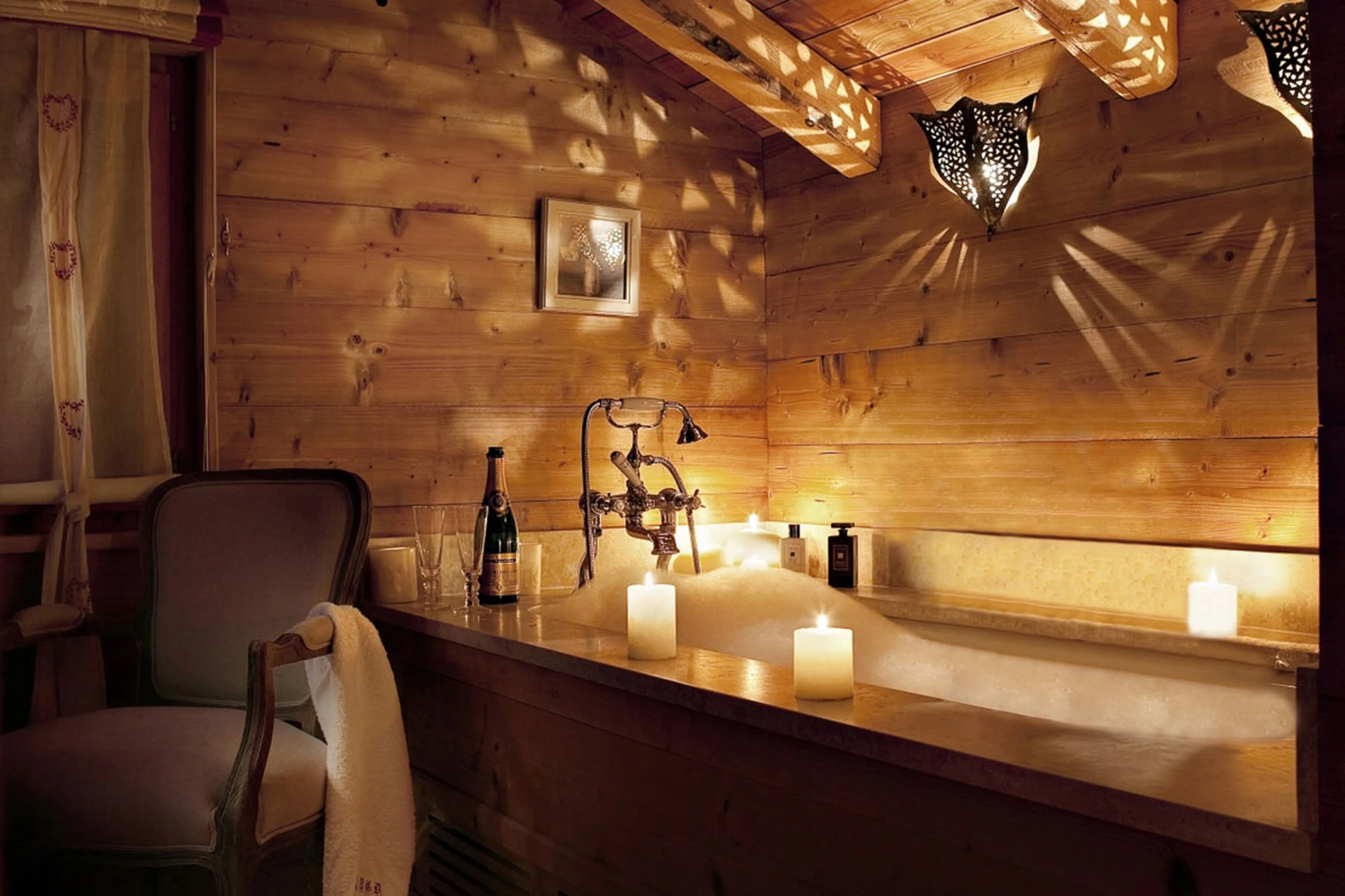 Master bathroom with romantic lighting in Chalet Bear in Klosters