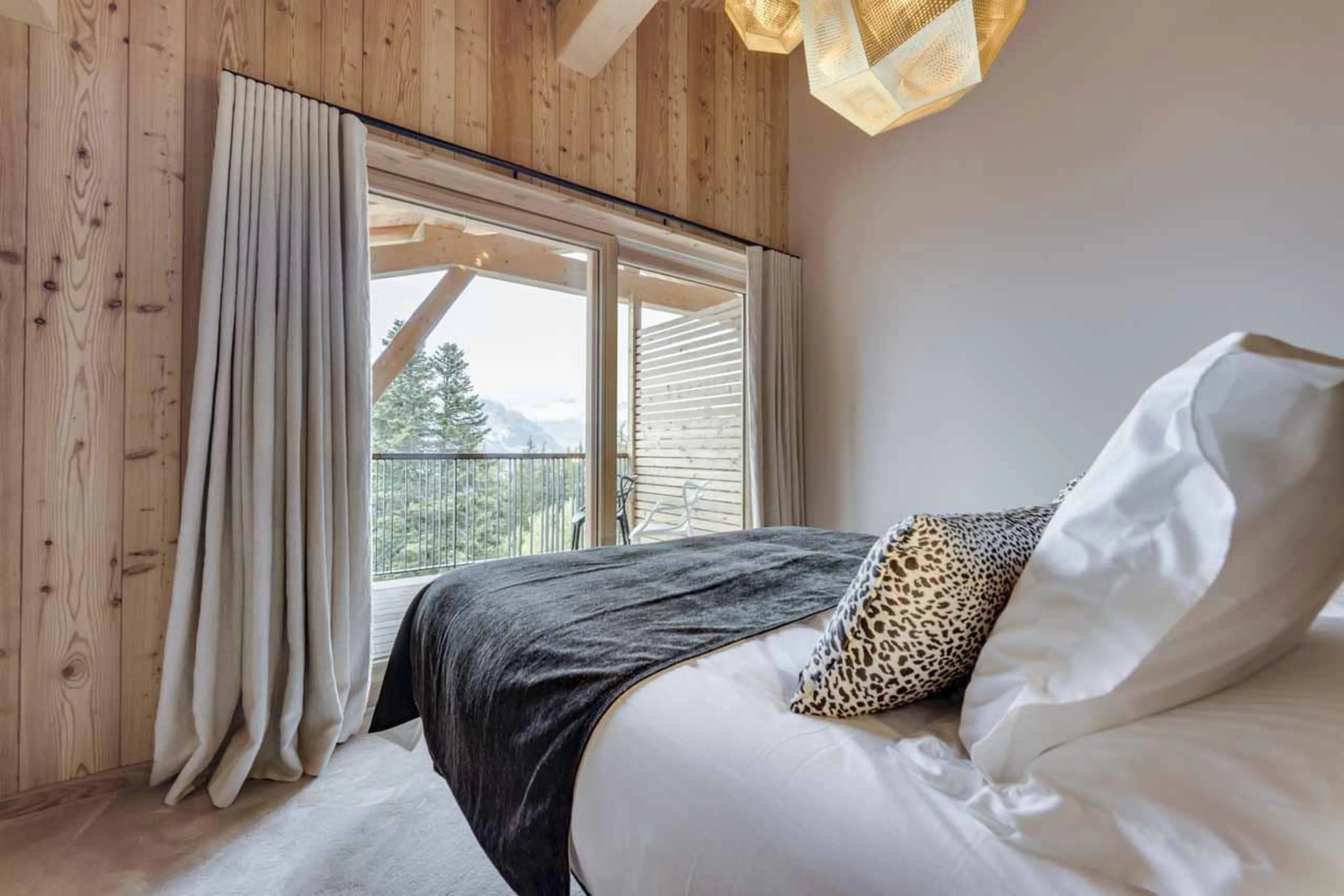 Mountain views from bed at Chalet Bela Vya 2 in Les Arcs