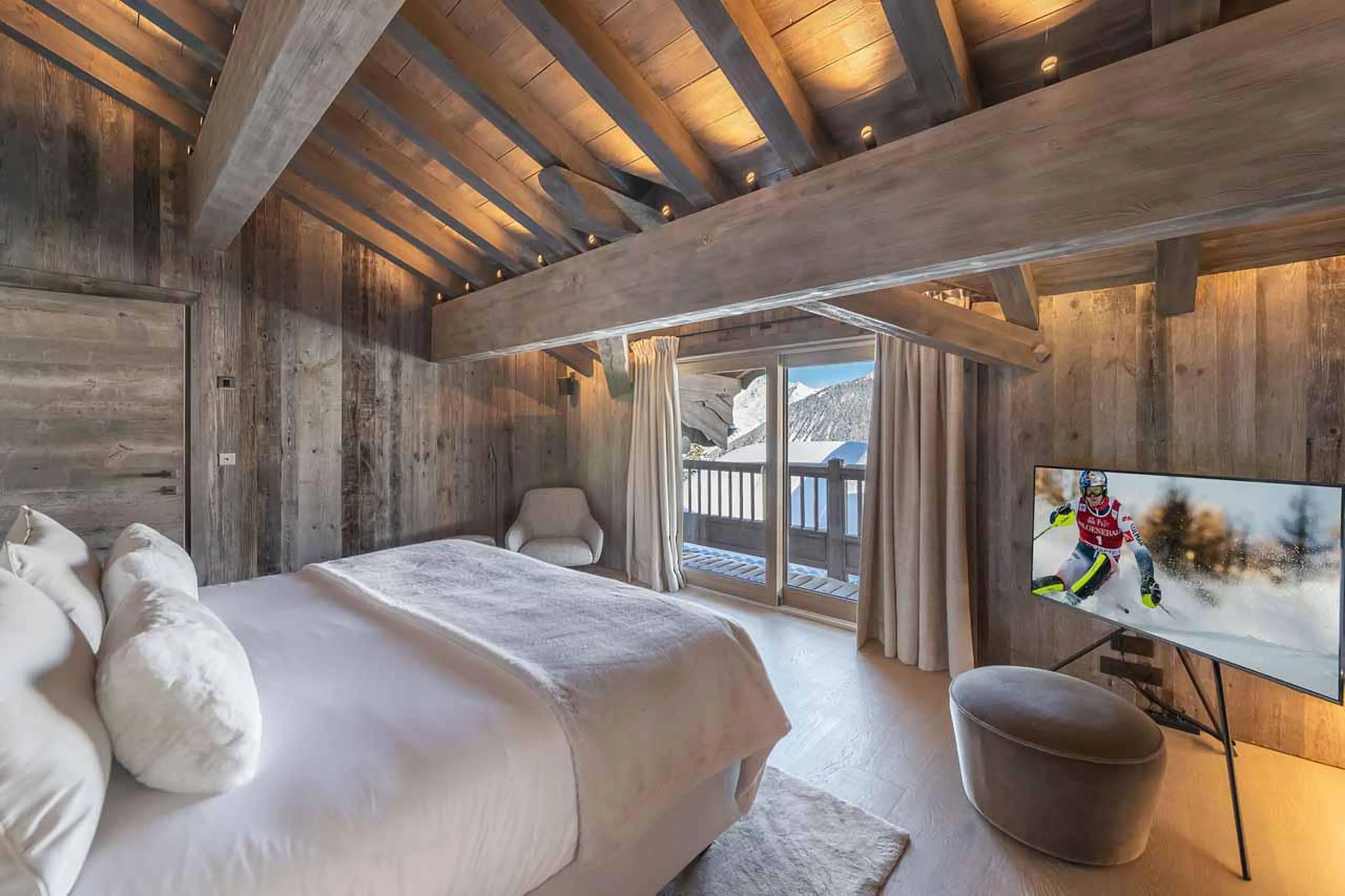 TV in master bedroom at Chalet Bellarossa in Courchevel 1850