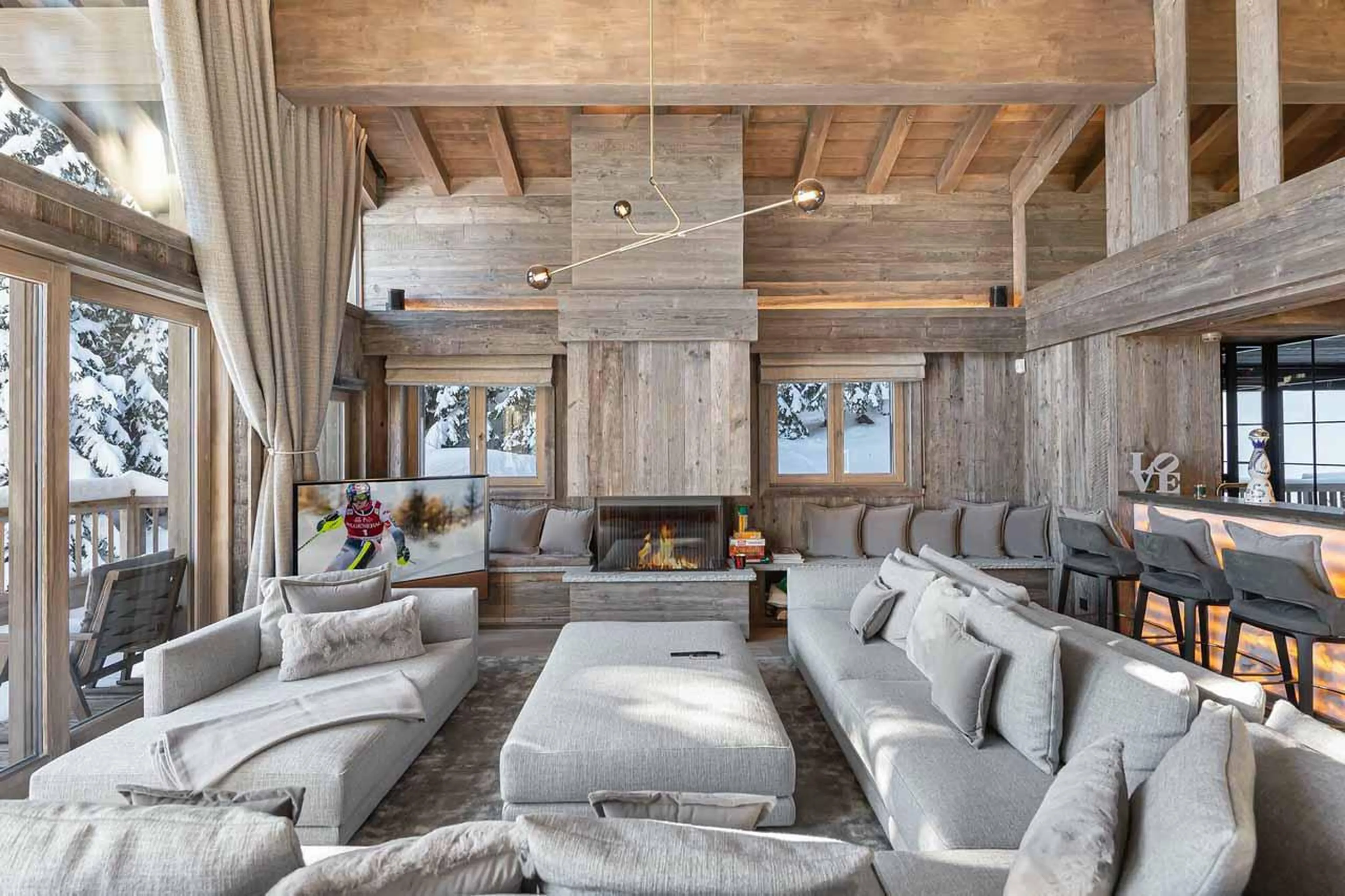 Living room with fireplace at Chalet Bellarossa in Courchevel 1850