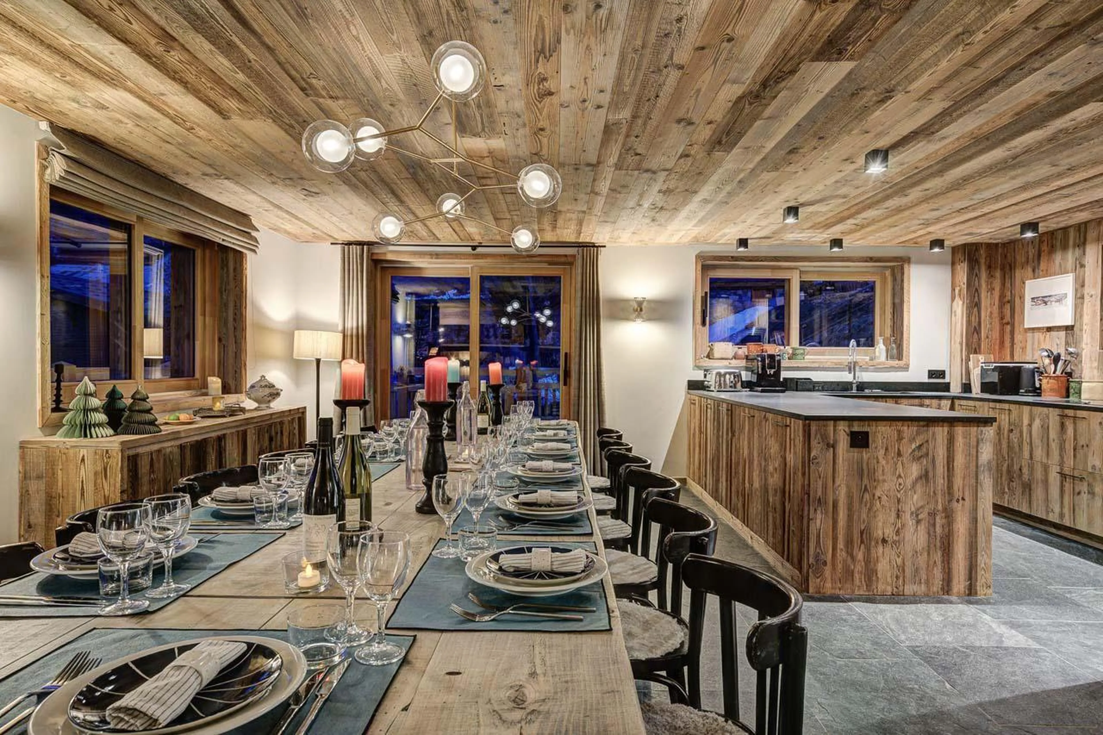 Well-equipped kitchen overlooking the dining space at Chalet Bergeronnette in Meribel
