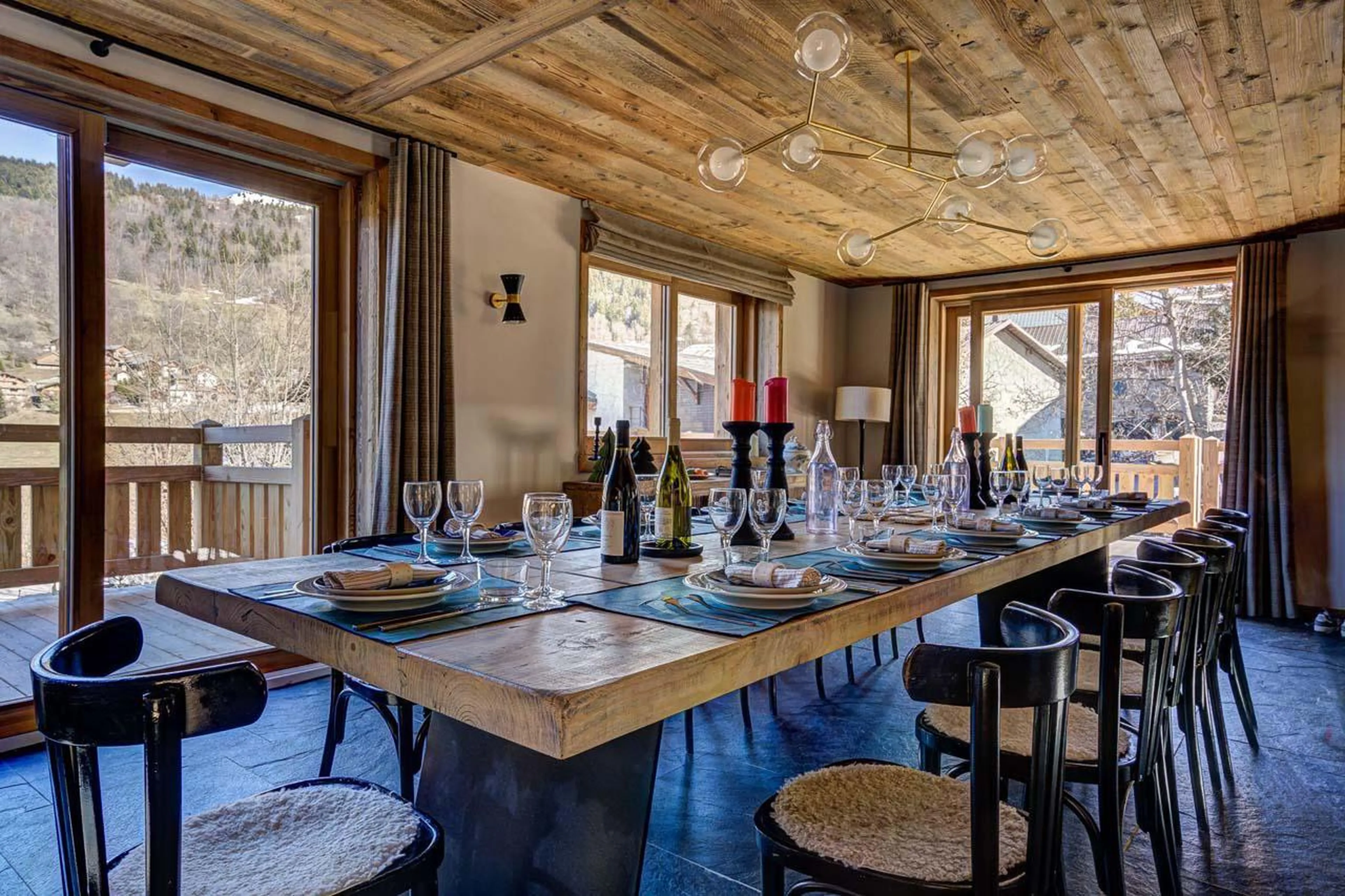 Dining table overlooking beautiful mountain views at Chalet Bergeronnette in Meribel