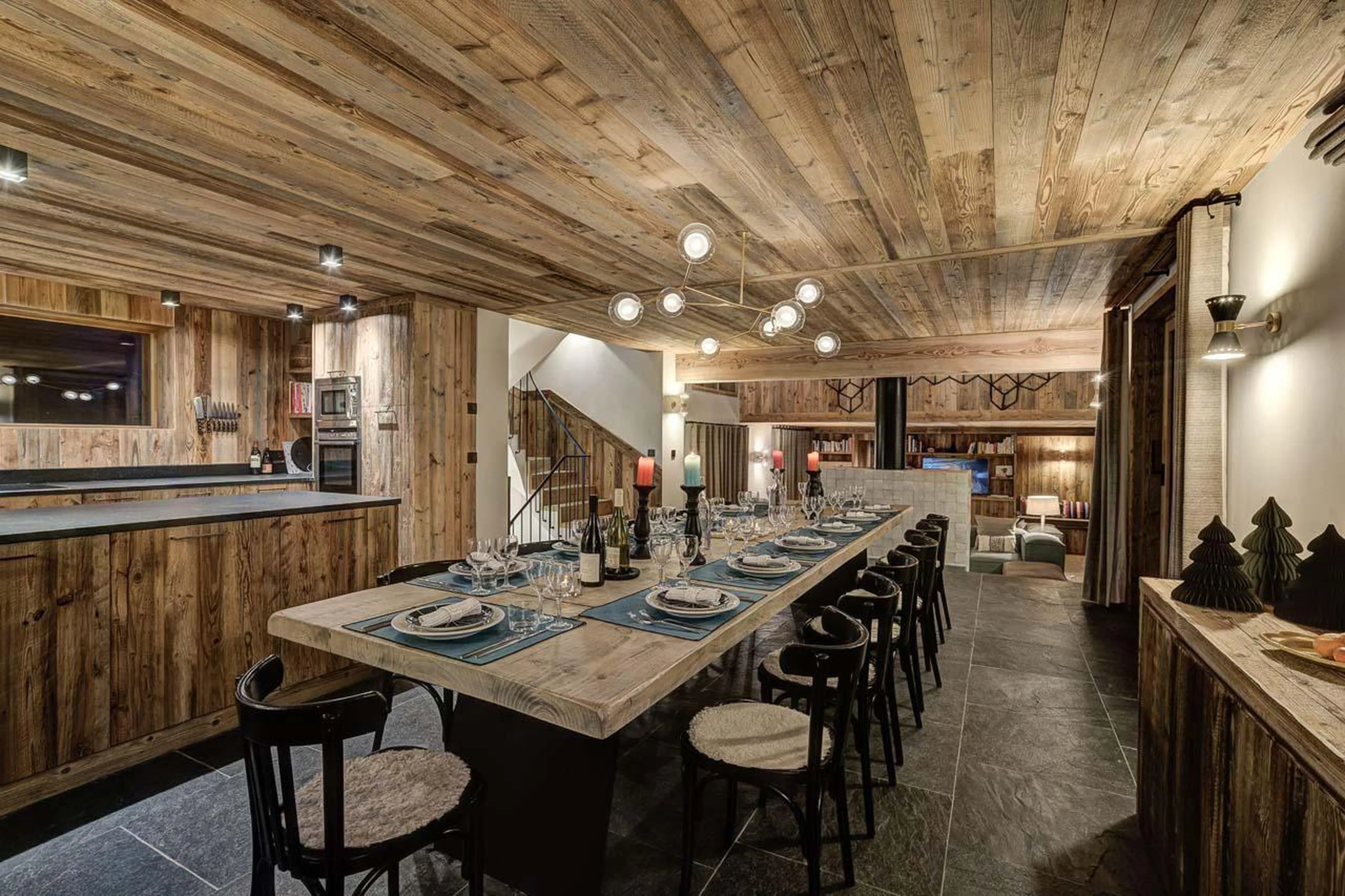 Open-plan living area with rustic alpine feel at Chalet Bergeronnette in Meribel